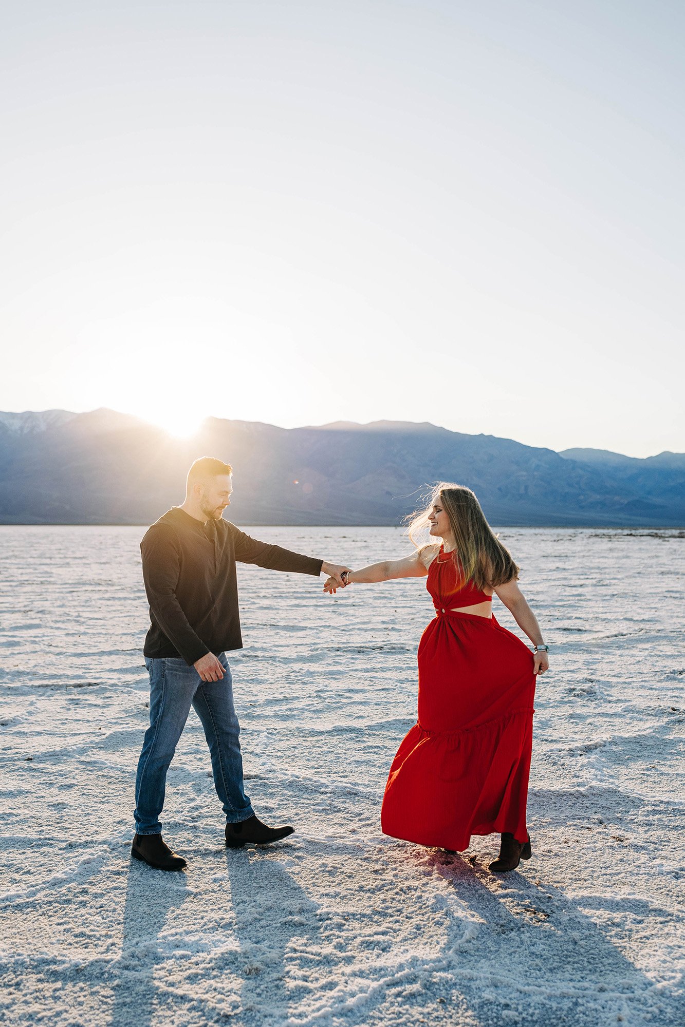 Alex and Aly dance on the salt flats of Death Valley National Park.