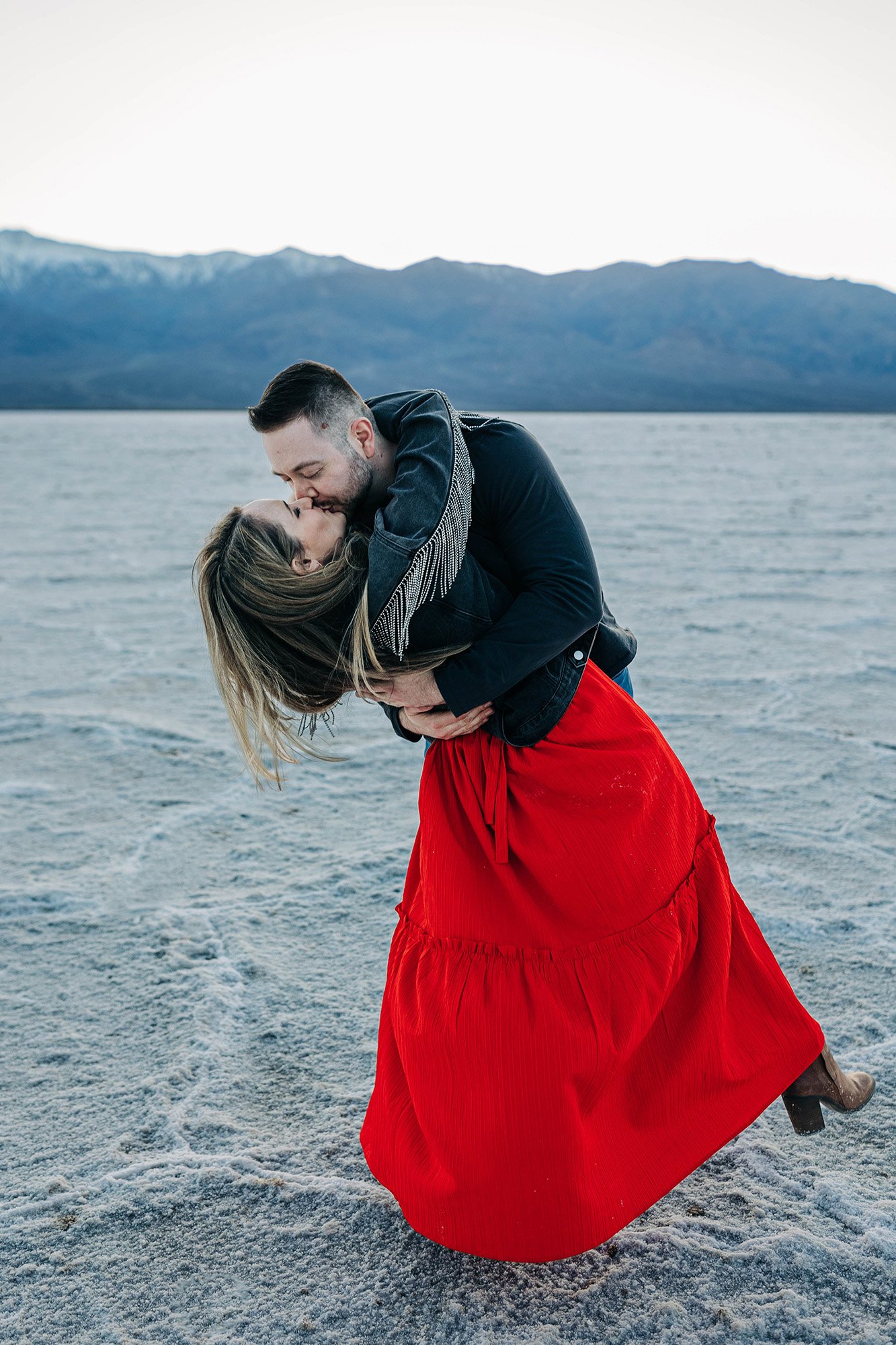 A couple shares a dramatic dip and kiss.