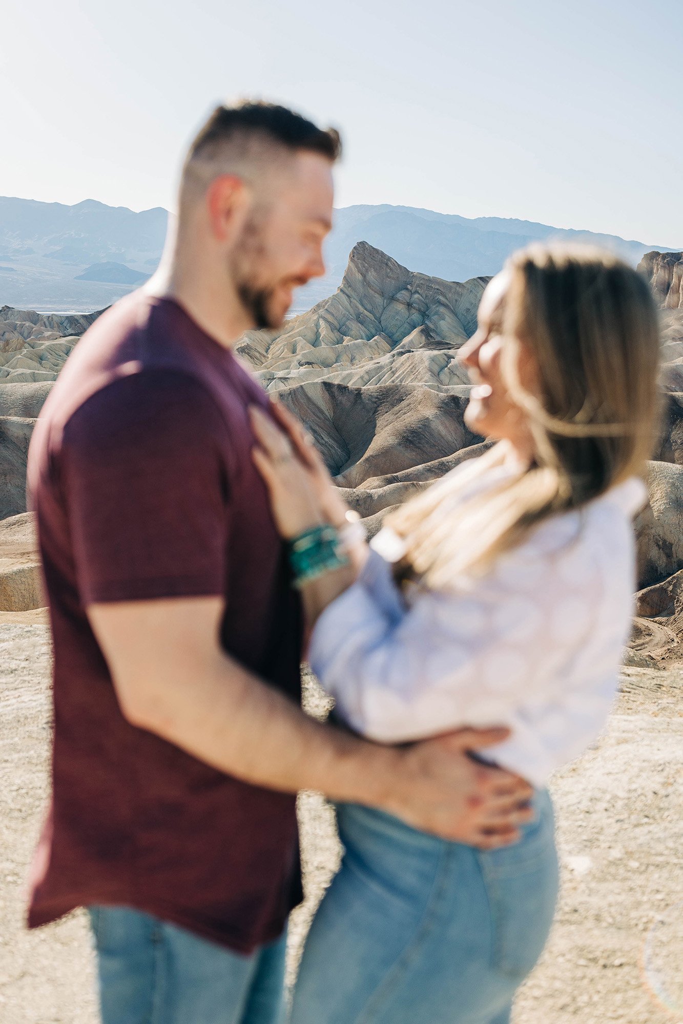 A view of a mountain through a blurry couple.