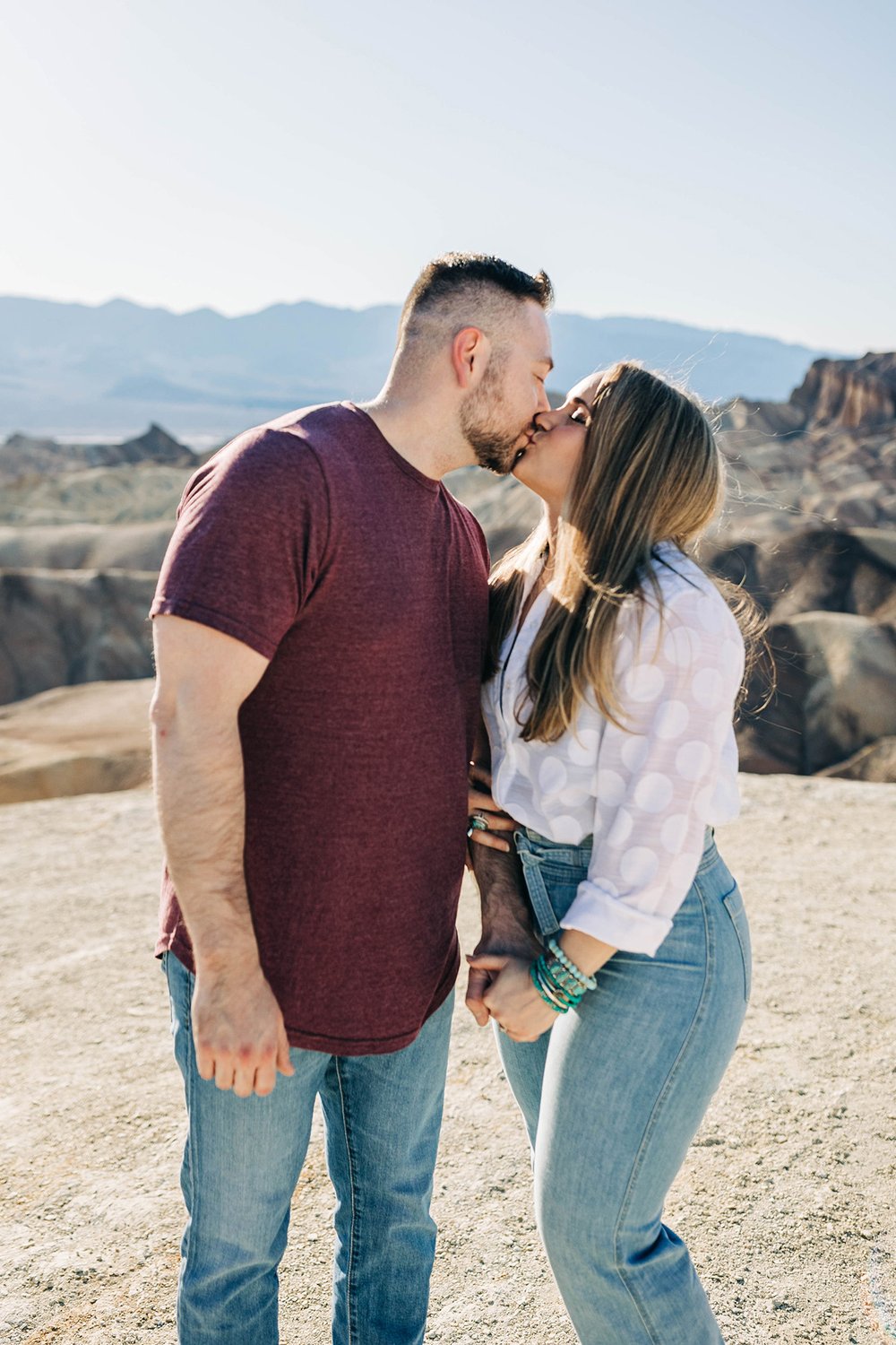 Aly &amp; Alex kiss at Death Valley National Park during their engagement session.