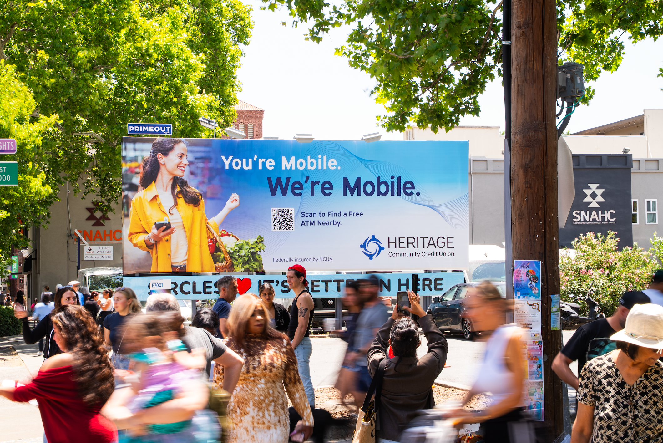 Heritage Community Credit Union billboard at the Sacramento Farmers Market to advertise their ATM and mobile access.