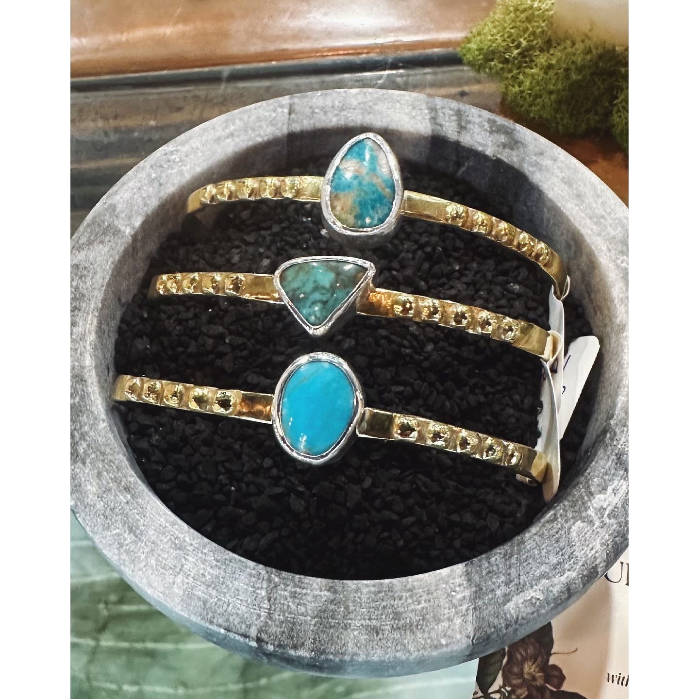 You can find these recycled bronze cuffs adorned with turquoise cut by @danthecabman at @workskennettsquare through the month of October. They were fun to make and I'm working on a handful (or should I say &quot;wristful&quot; 😂) for next week's thr