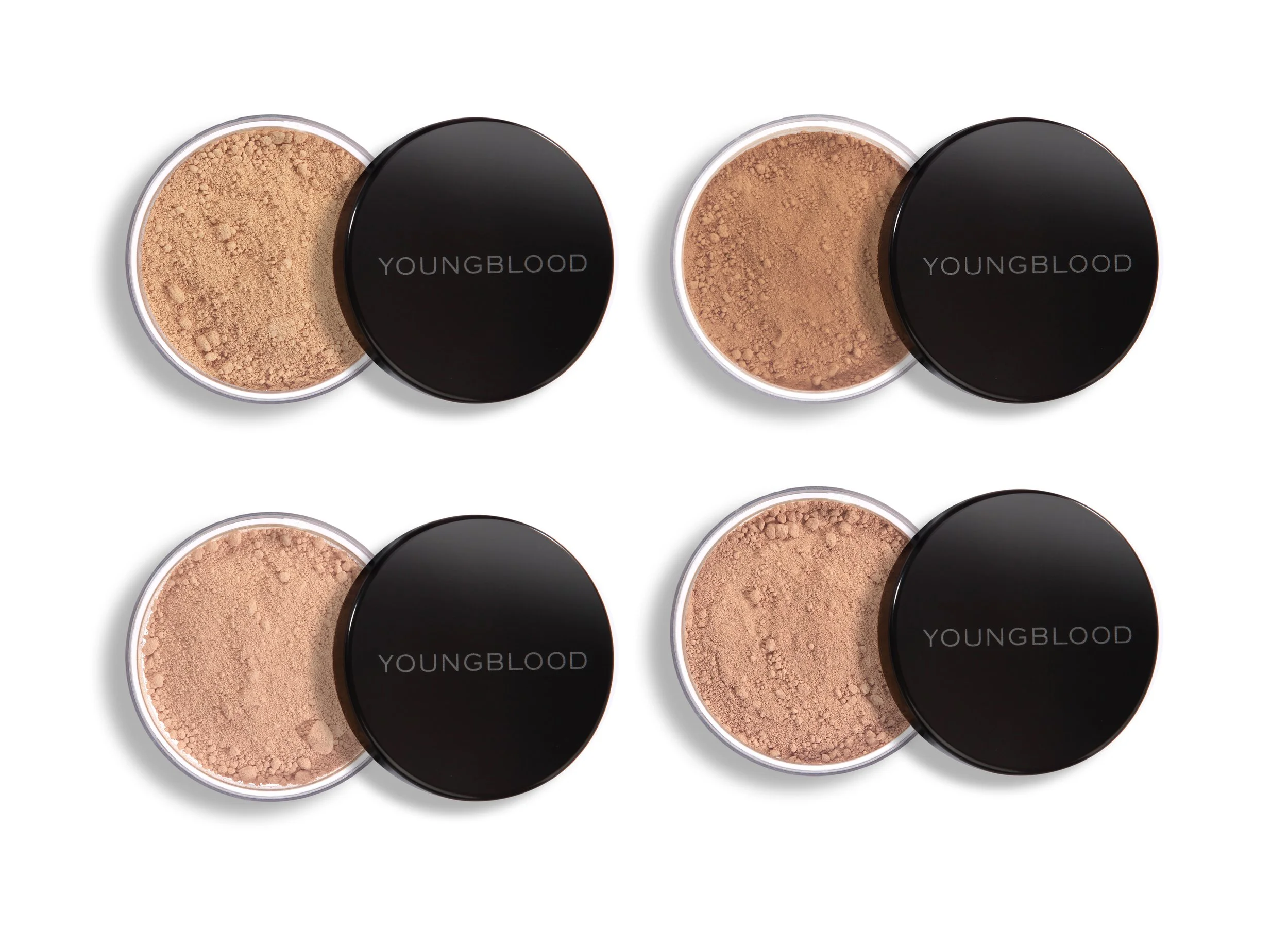 Four containers of Youngblood loose powder foundation with black lids.