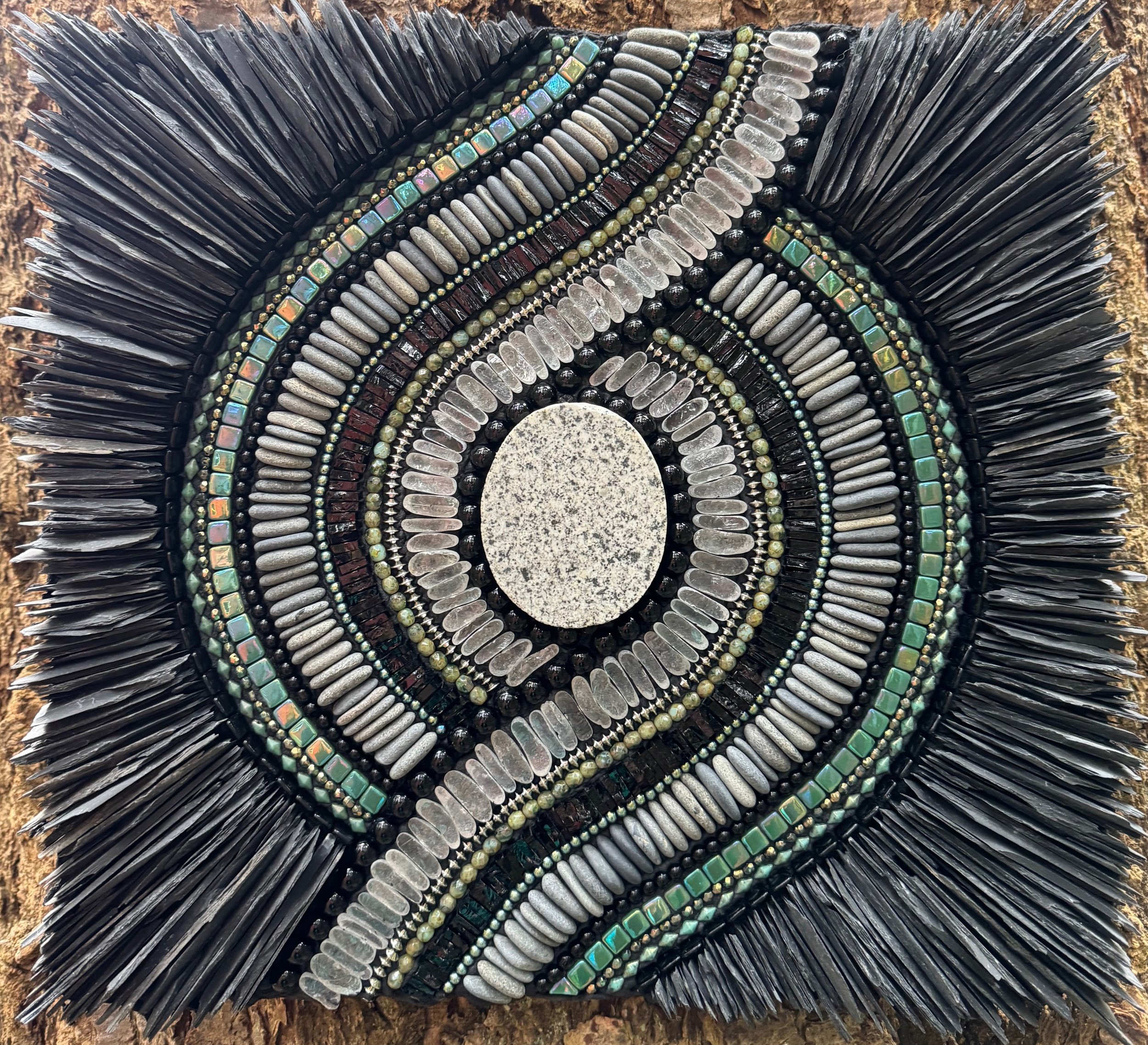 "Granite Spyglass" - Central cobble of granite brought to the shores of the Salish Sea from points north during the Pleistocene ice age. Beach glass and pebbles aslo from the beaches of the Olympic Peninsula, WA. Glass and metal beads, glass tiles, s