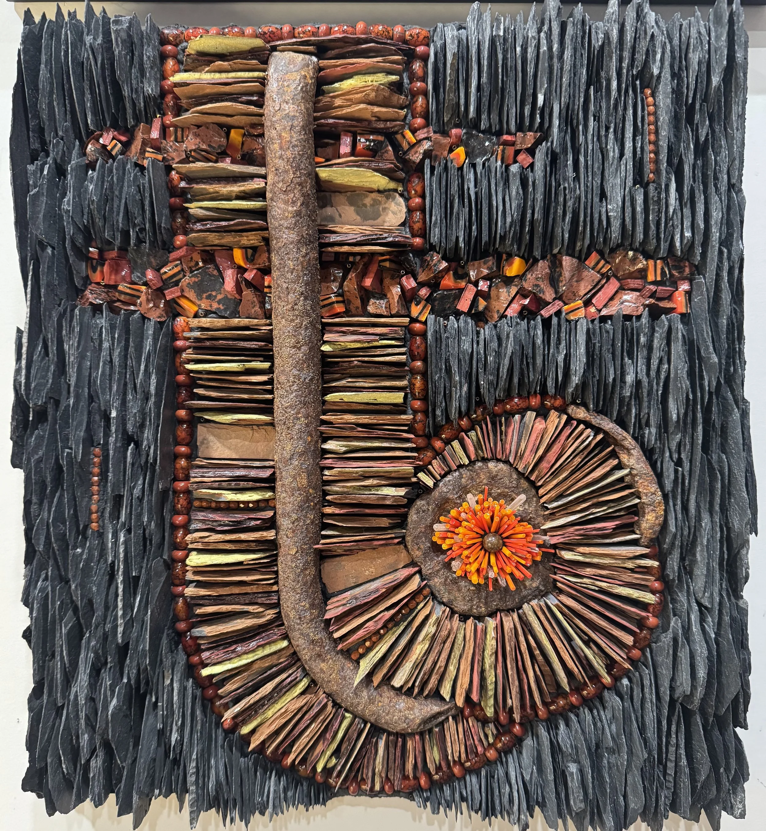 "So Noted" - Natural Slate (black); kiln fired (rust); glazed and kiln fired (yellow, orange, red), Smalti, Strata glass, mahogany jasper, glass beads and rods, quartz points, scavenged metal from North Beach, Port Townsend. On Wediboard in tinted th