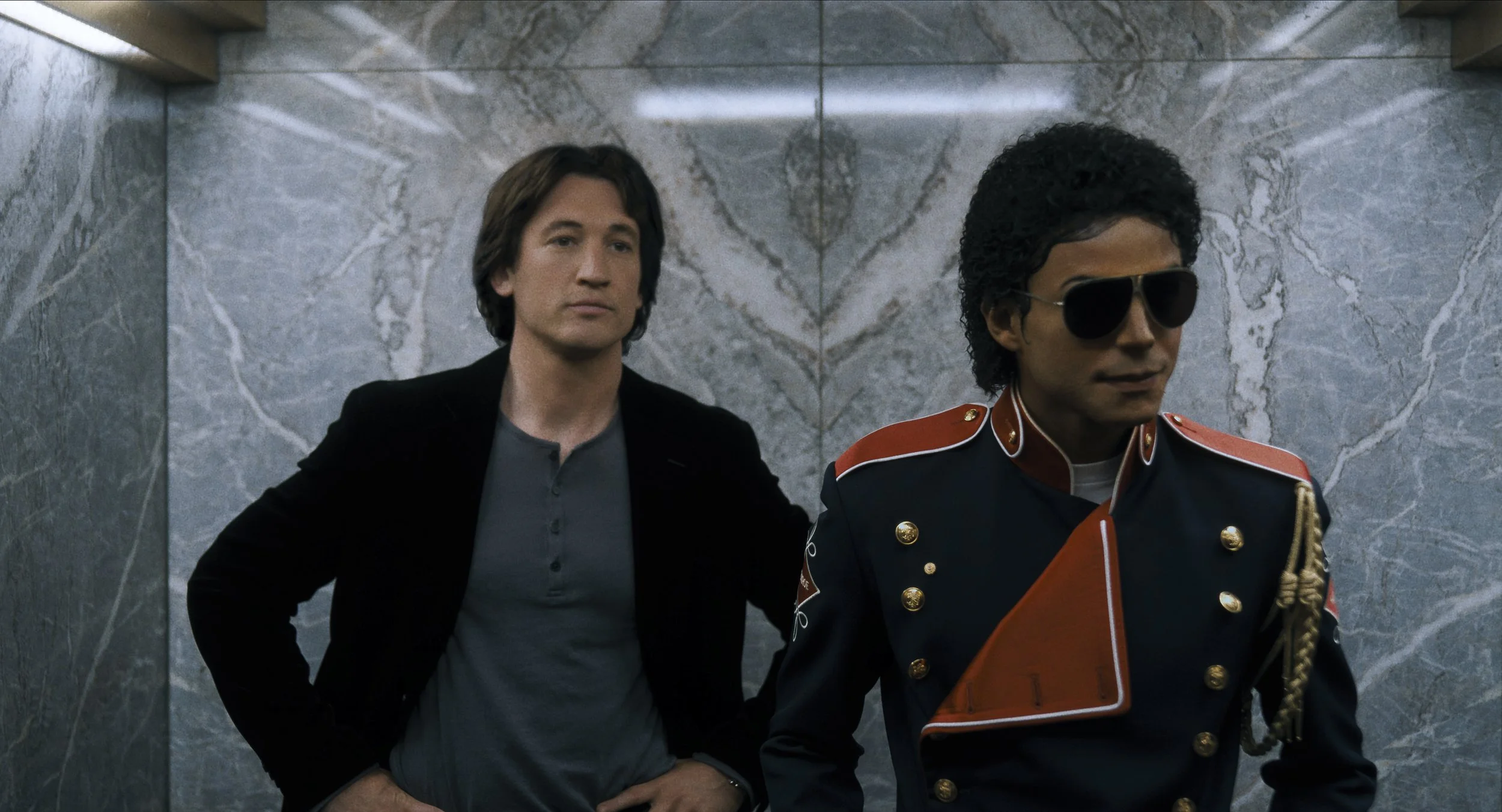  Miles Teller as John Branca and Jaafar Jackson as Michael Jackson in  Michael  • Photo Credit: Lionsgate 