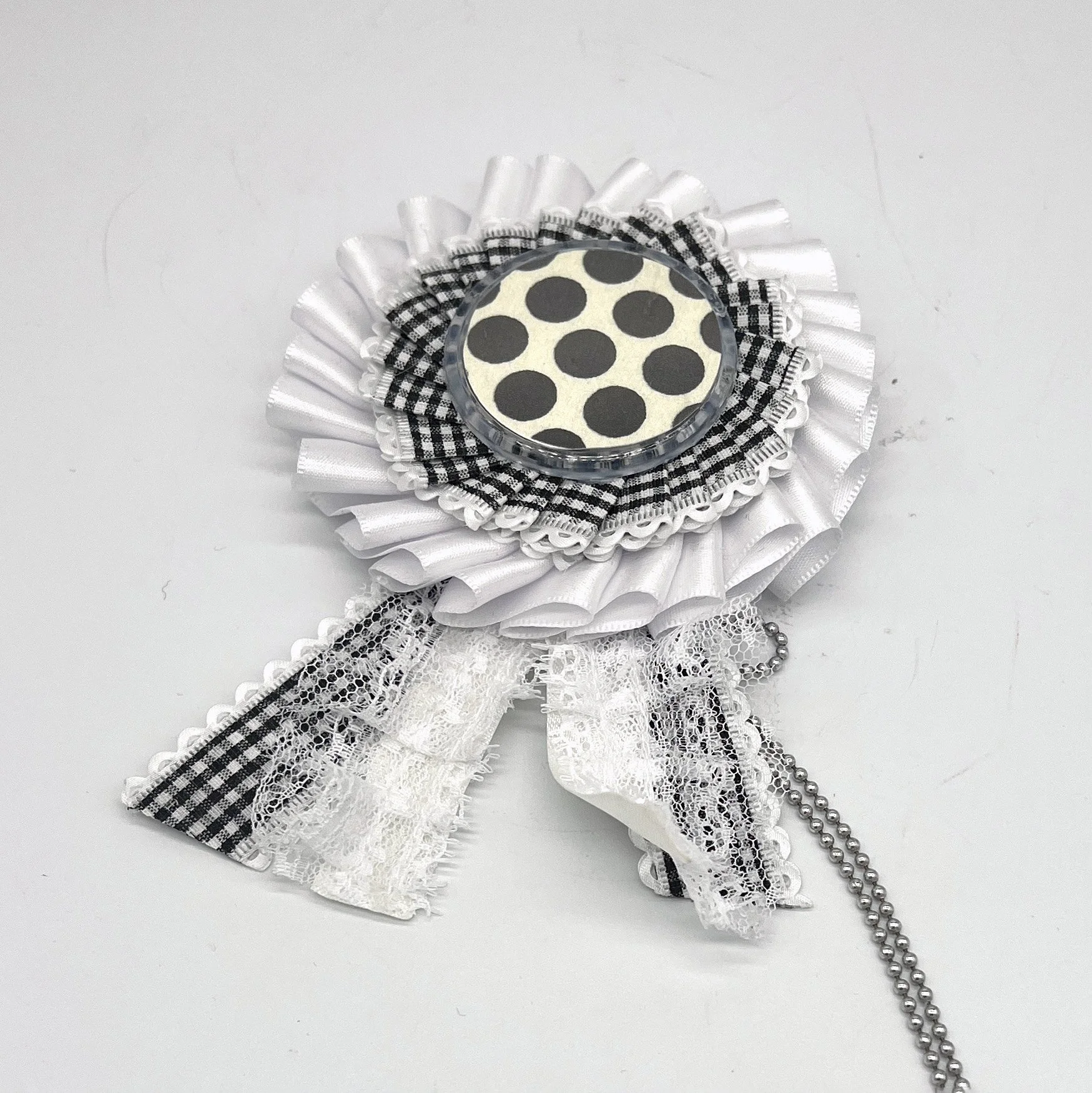THE LAUGHING GEISHA White Rosette Badge