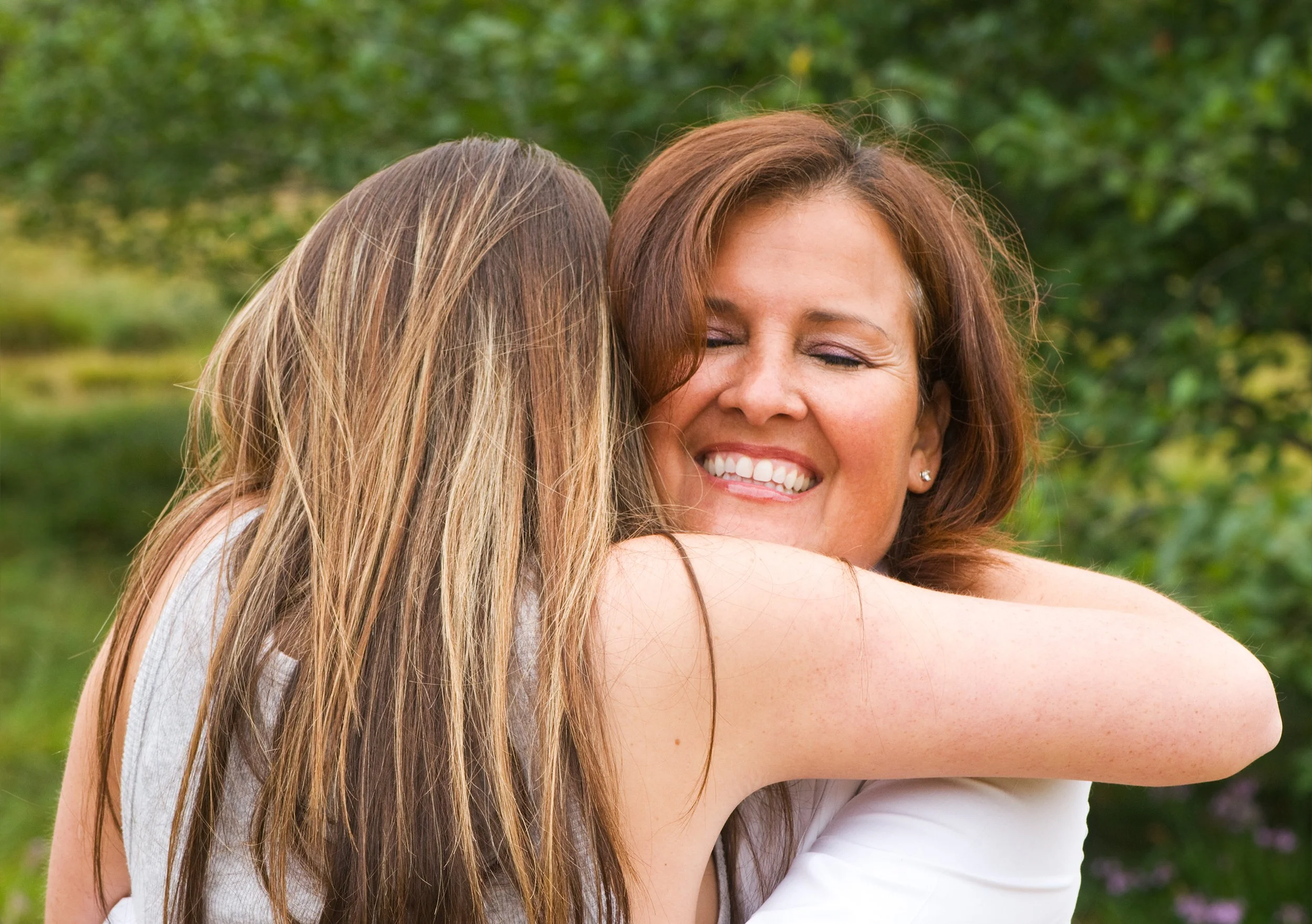 mother and daughter hugging
