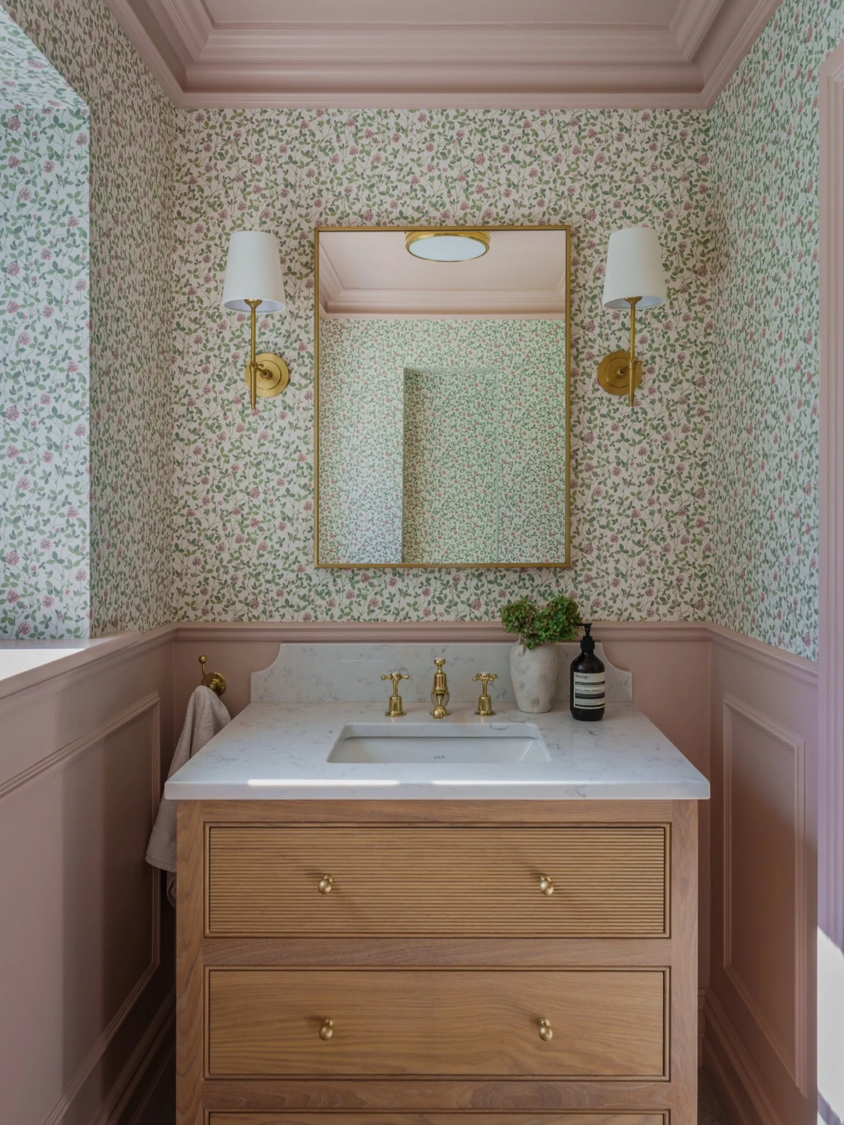 The guest loo is always where you can go a bit bolder. Our client wanted to introduce a statement wallpaper and some pink in her home, but in a subtle way, so the loo was the perfect place to do this! What was a dark study, has now been split into tw