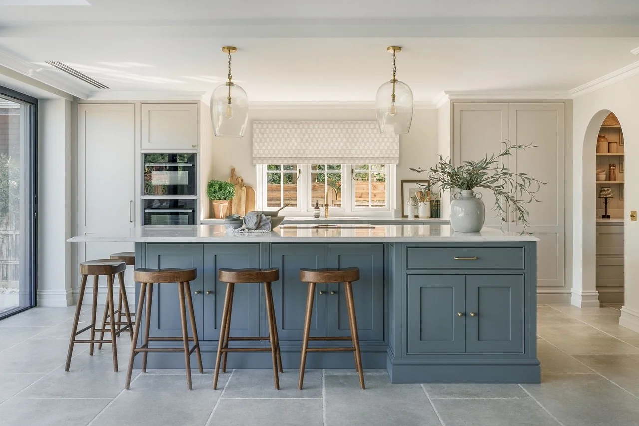 The kitchen at our River House project in all its glory. This was a slightly more contemporary kitchen for us to design but we had a lot of fun with the blue island. The kitchen then leads into the pantry through the arch which follows through to the