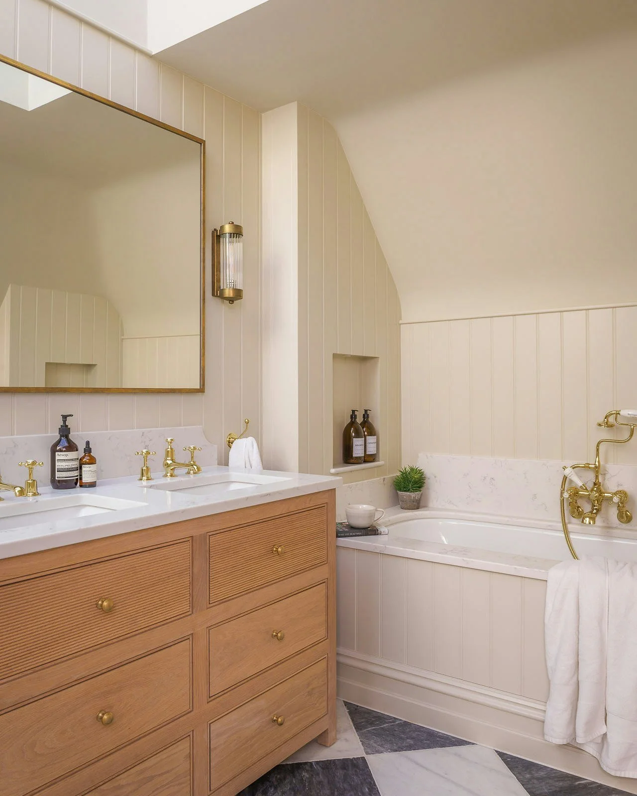 Step inside the primary en-suite at our River House project, one of our favourite rooms in this house. Swipe across to see more of this space ➡️

Tucked beneath the eaves, every detail was considered to create a bathroom that feels serene and calm fo
