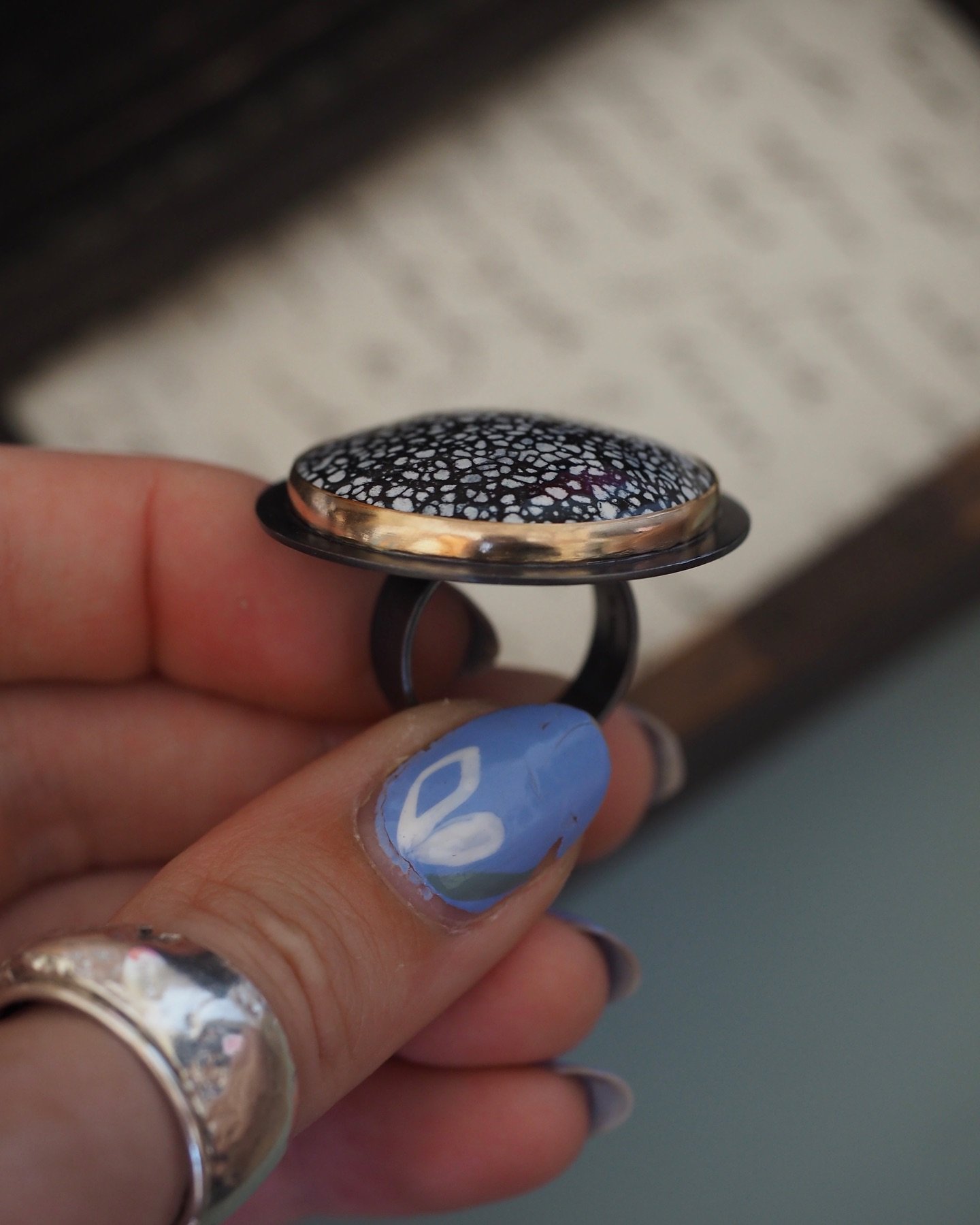 I can finally share with you this absolute showstopper of a ring which was commissioned after @craftfestival Cheltenham in March. Oxidised silver with enamel set in 9ct gold. I loved making this and was a little sad to see it go but I know it will be