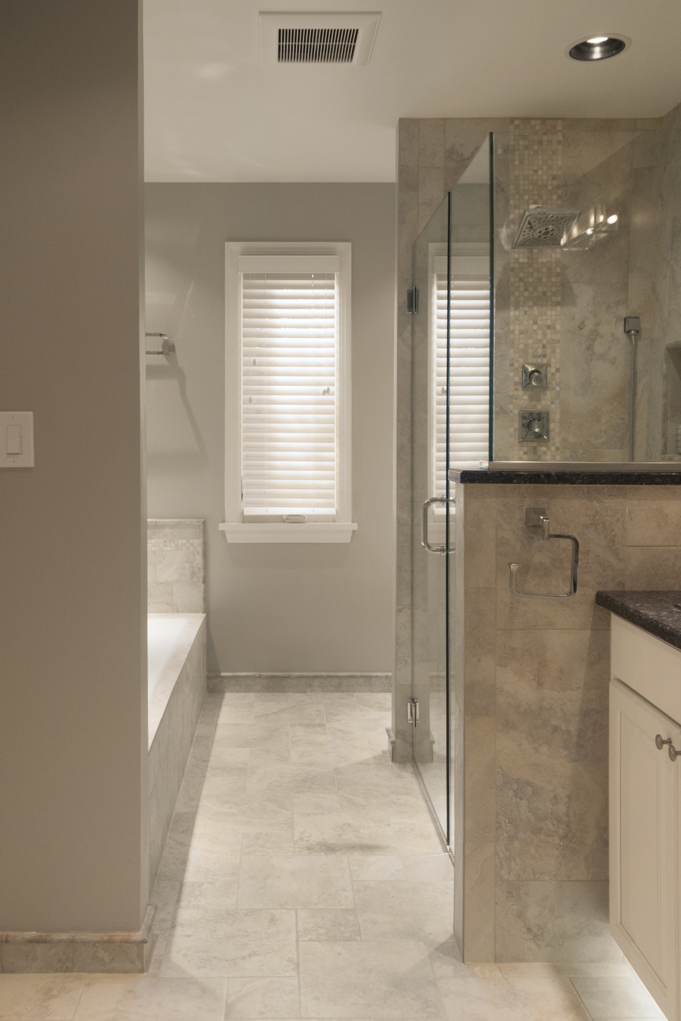 Natural stone bathroom with open shower