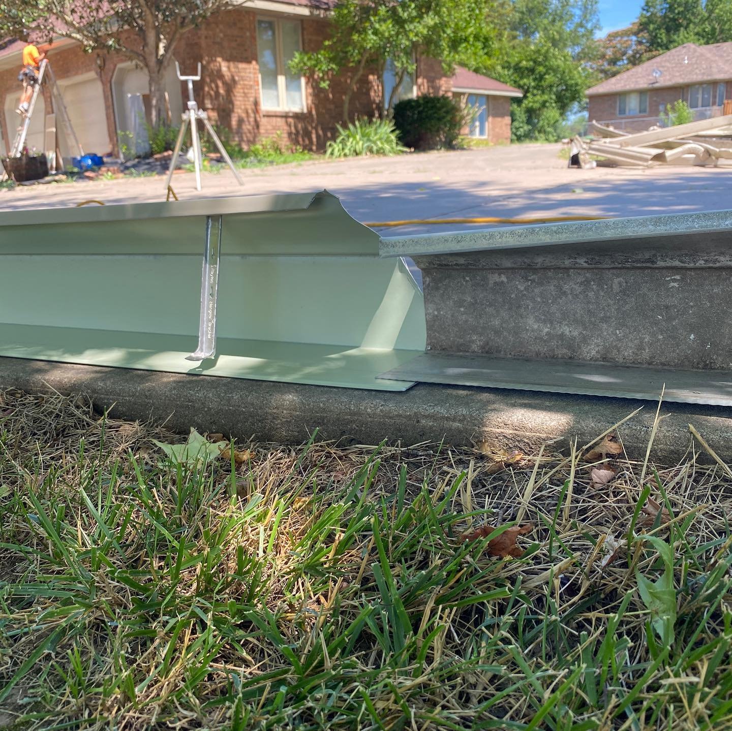 A side by side comparison of a homes old, smaller 5&rdquo; gutter and 2x3 downspout next to the new, larger 6&rdquo; gutter and 3x4 downspouts.
-
This home was having issues with water over spilling the gutters. Simply put, the gutters were too small