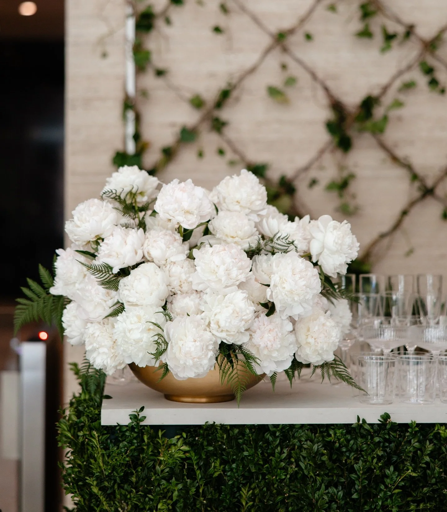 There&rsquo;s real power in a single bloom arrangement.
Clean, intentional, and impossible to ignore. Even better if paired with a fully custom Bar Fa&ccedil;ade made with fresh Boxwood. 
These giant white peonies say everything without saying too mu