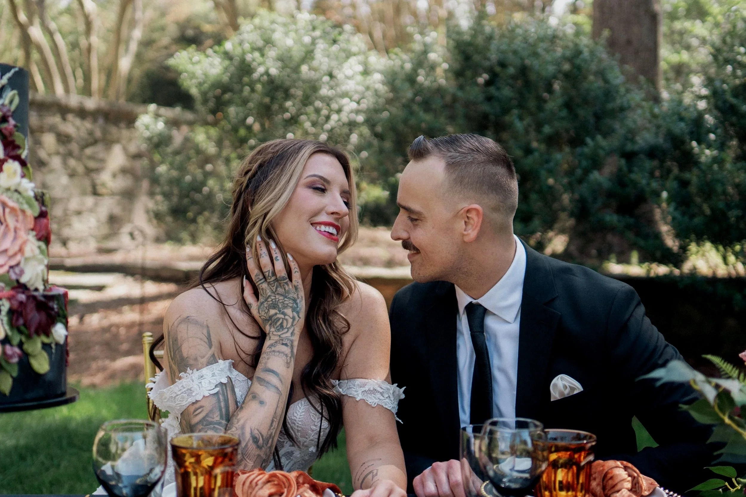 wedding couple share a laugh over cake