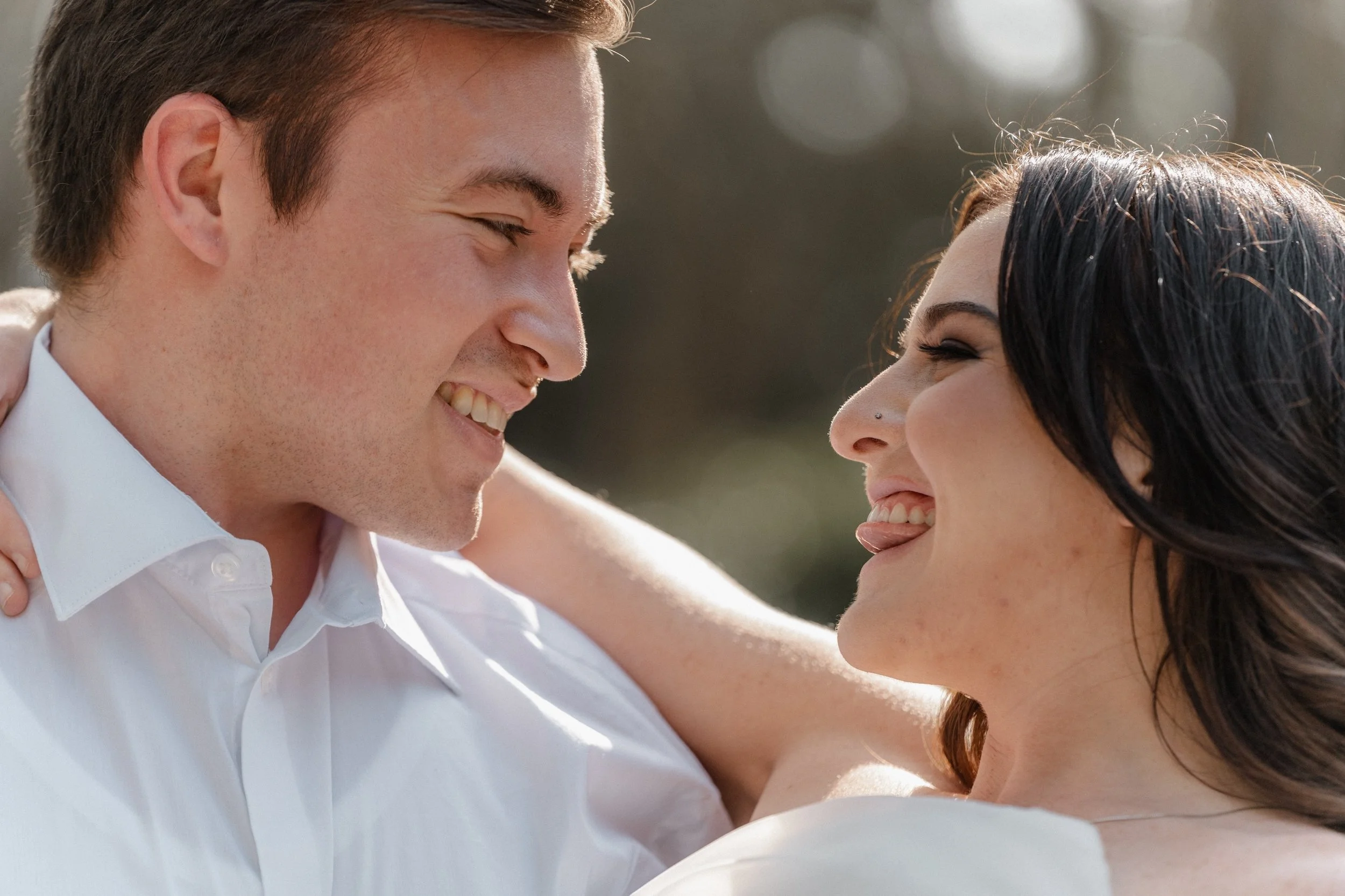 The couple gazes at one another, faces glowing with natural light, a quiet and intimate portrait — Villa d’Este Wedding Photographer.