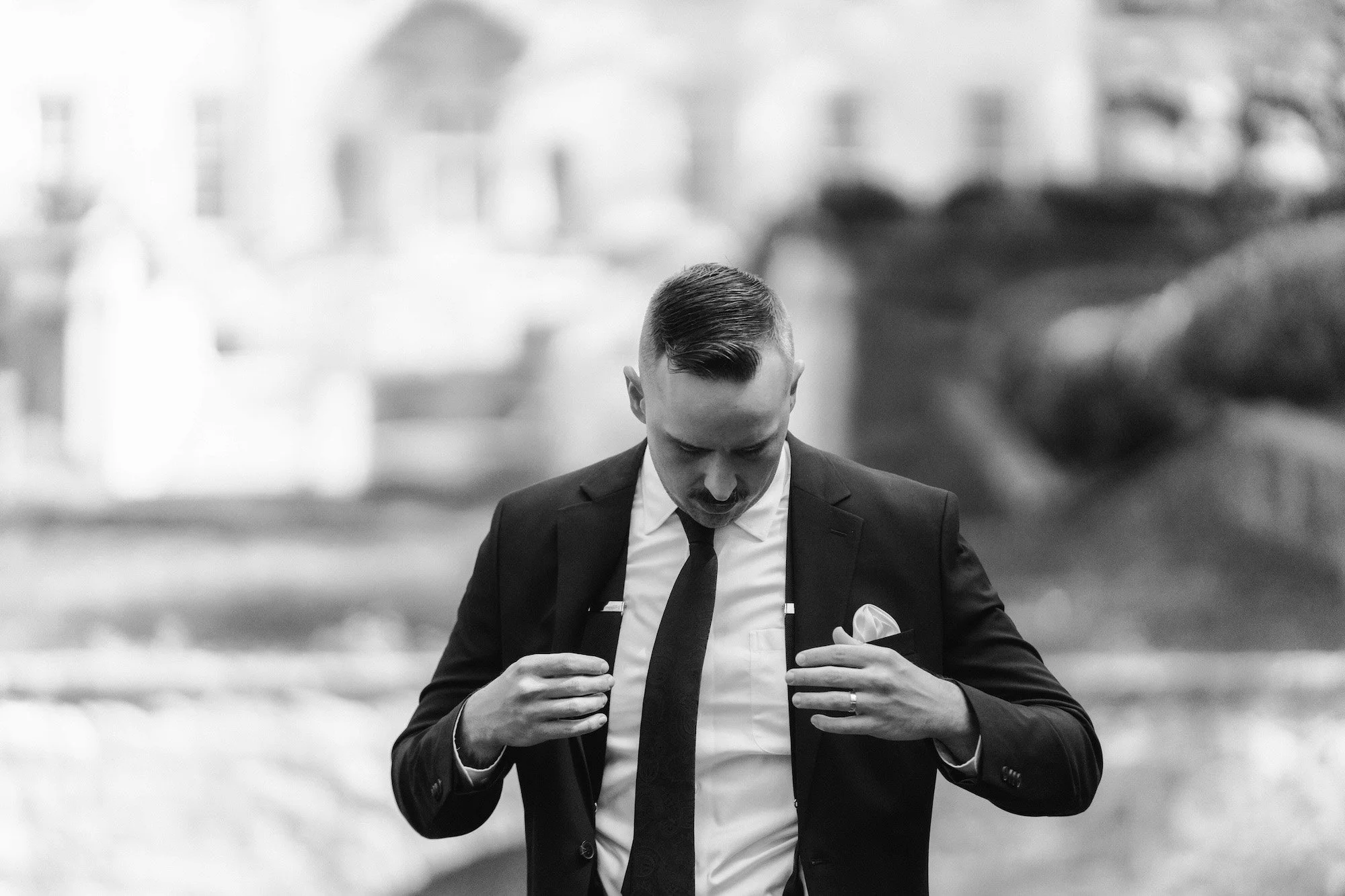 groom getting ready for portraits by NYC editorial photographer Caz Isaiah