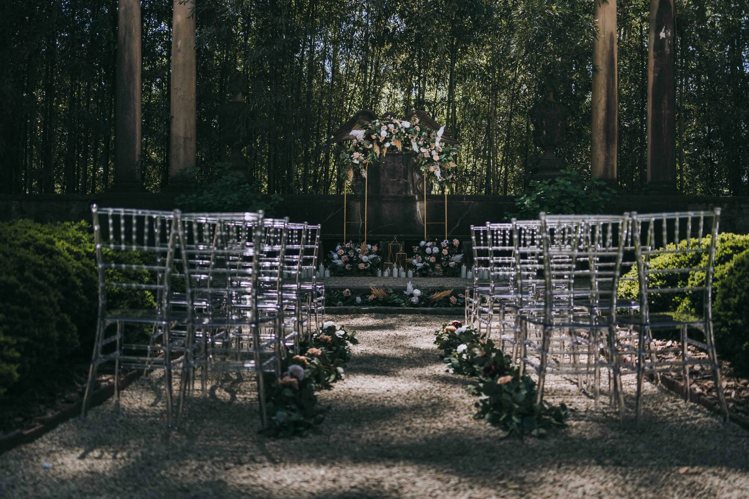 An elegant ceremony setup surrounded by trees and filtered sunlight, evoking the refined serenity of Amangiri’s sculptural design.