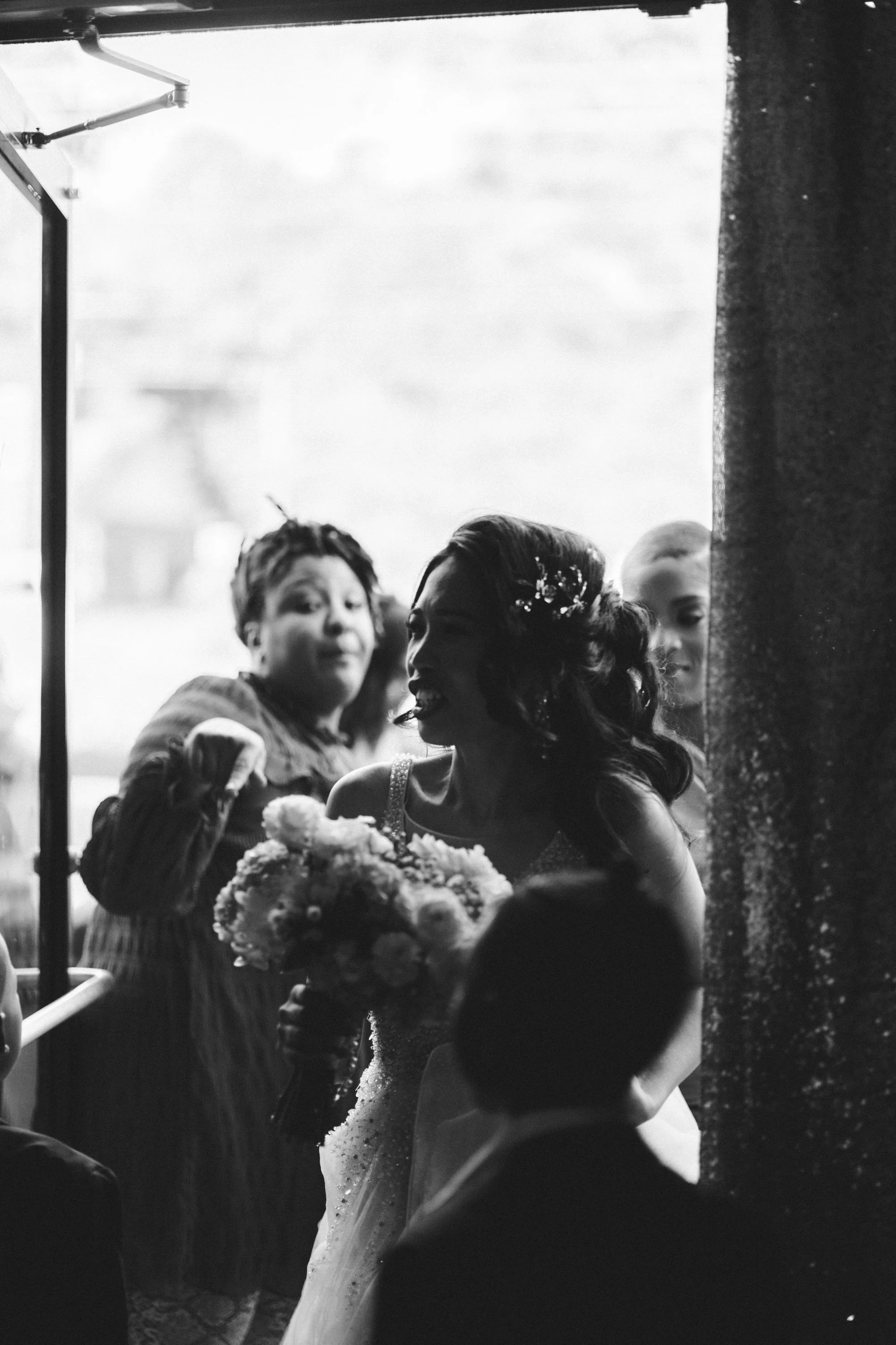 Filipino wedding— cinematic black-and-white moment of the bride entering with bouquet, capturing emotion, elegance, and timeless storytelling.