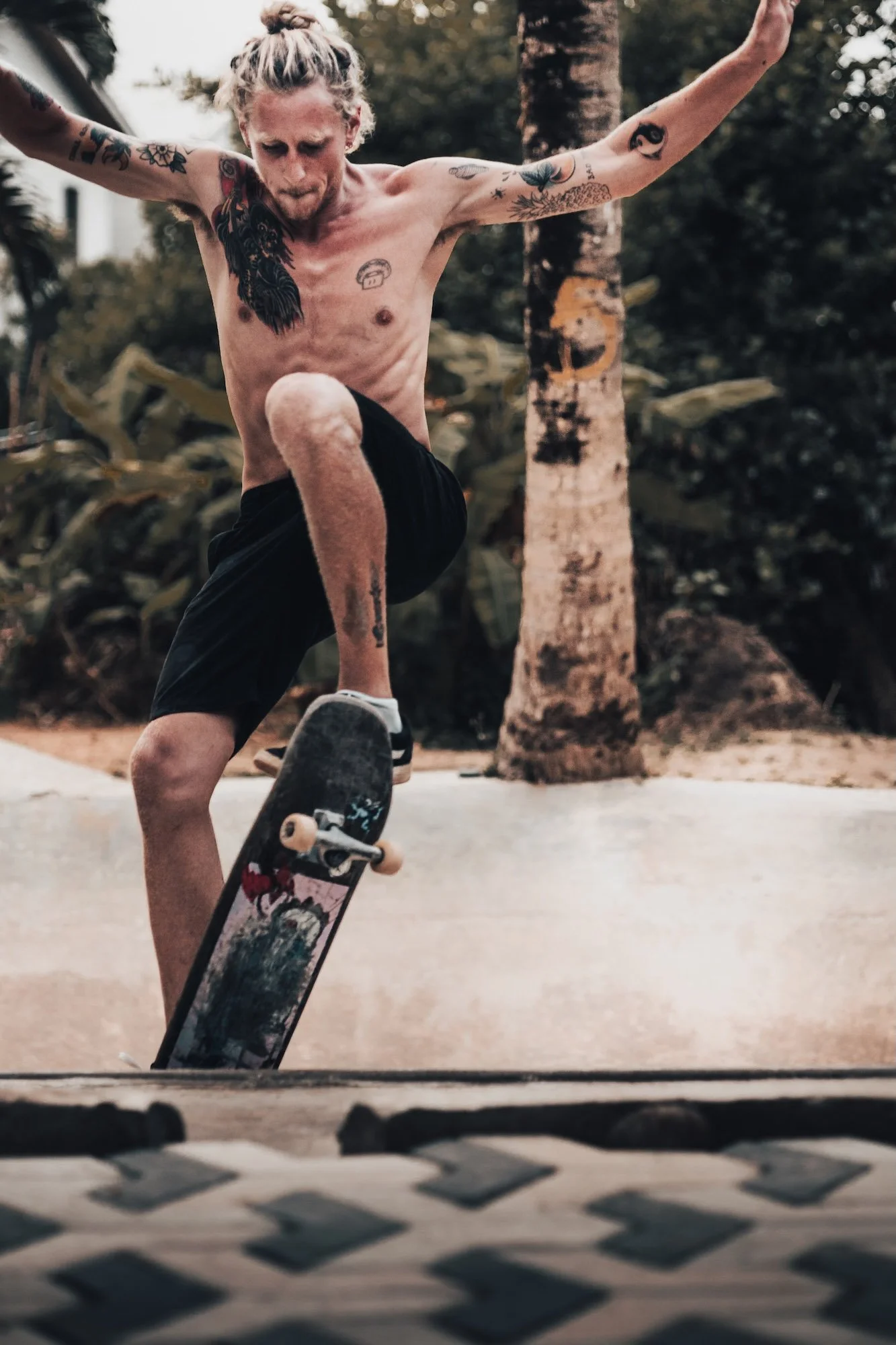 A skateboarder mid-trick, frozen in raw detail, captured by an editorial portrait photographer in SE As