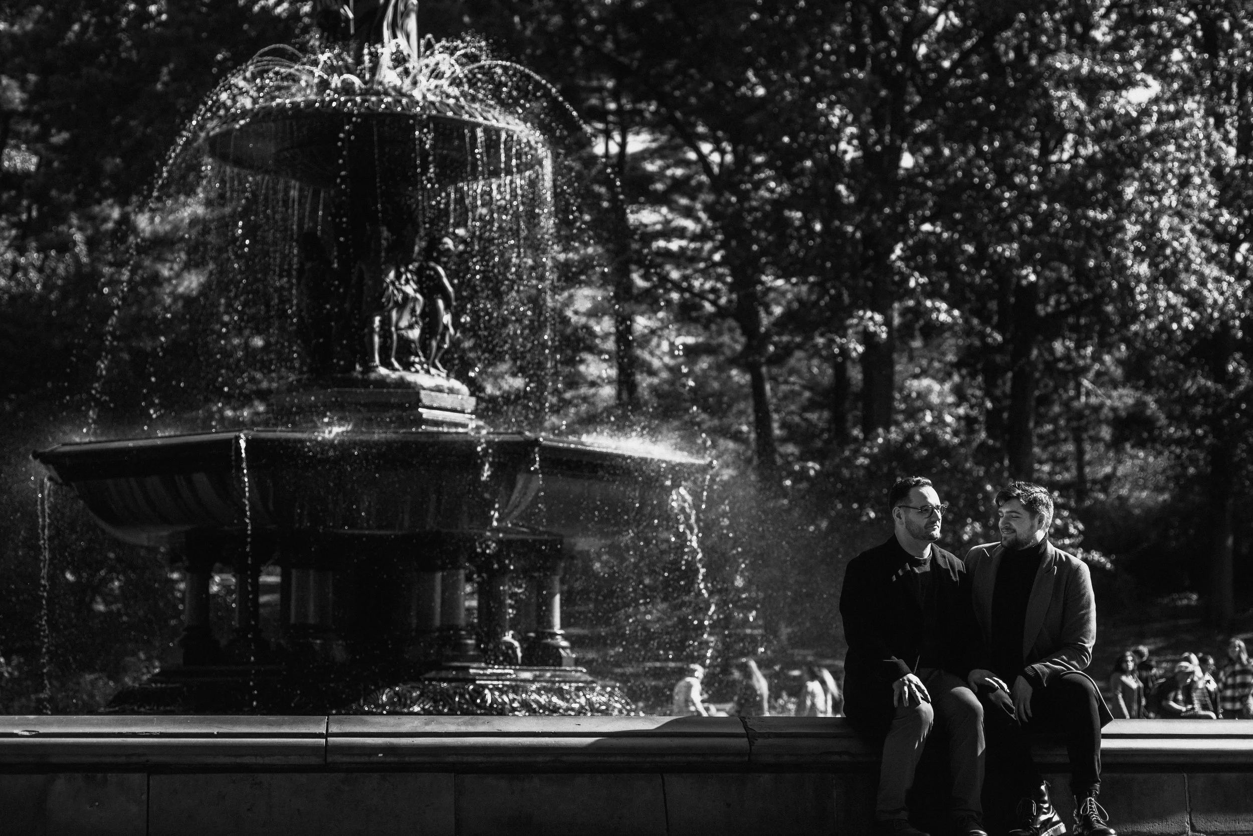 Black and white engagement at Top of the Rock — timeless proposal photography above Manhattan.