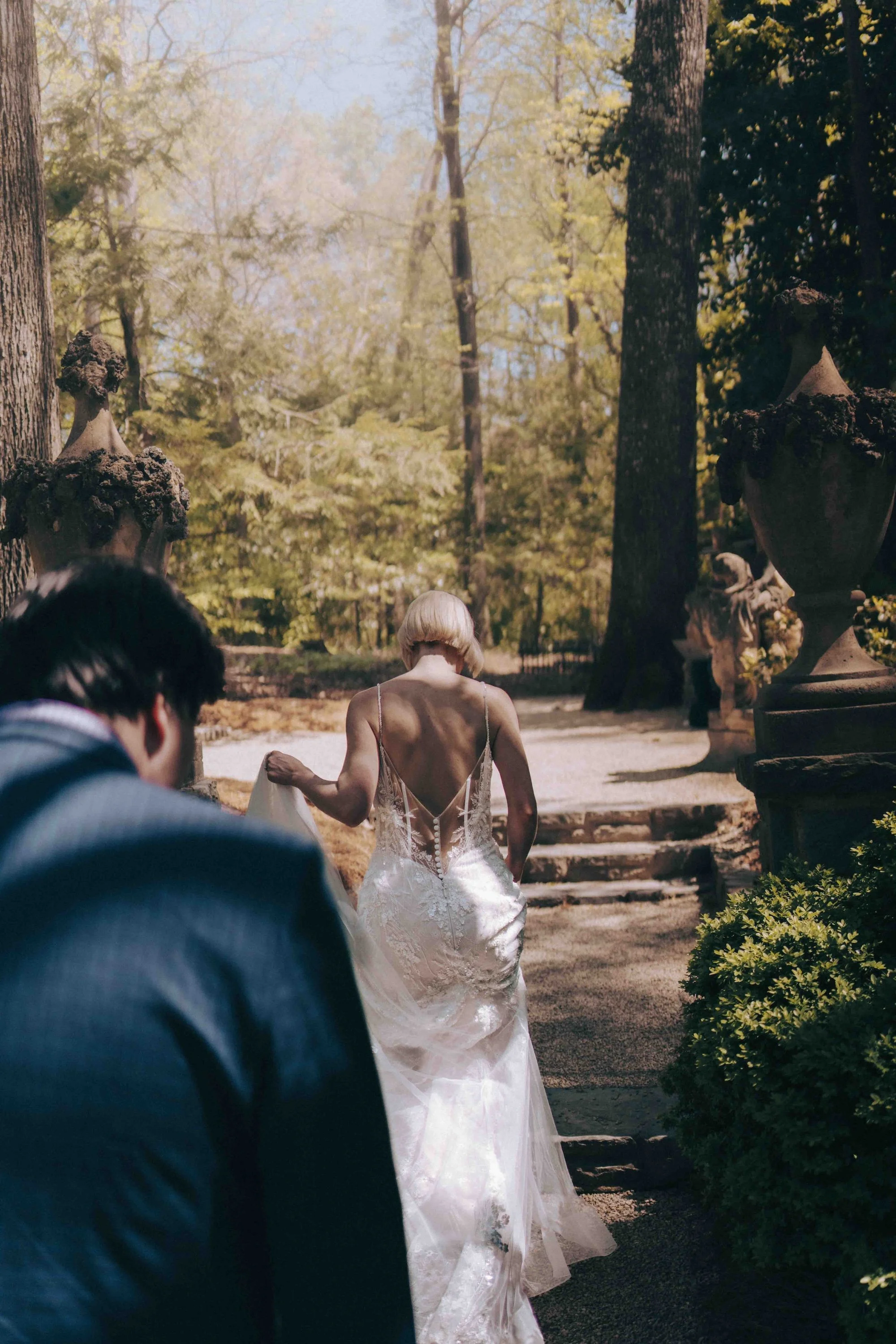 newly married couple walks thru Japanese inspired enchanted forest