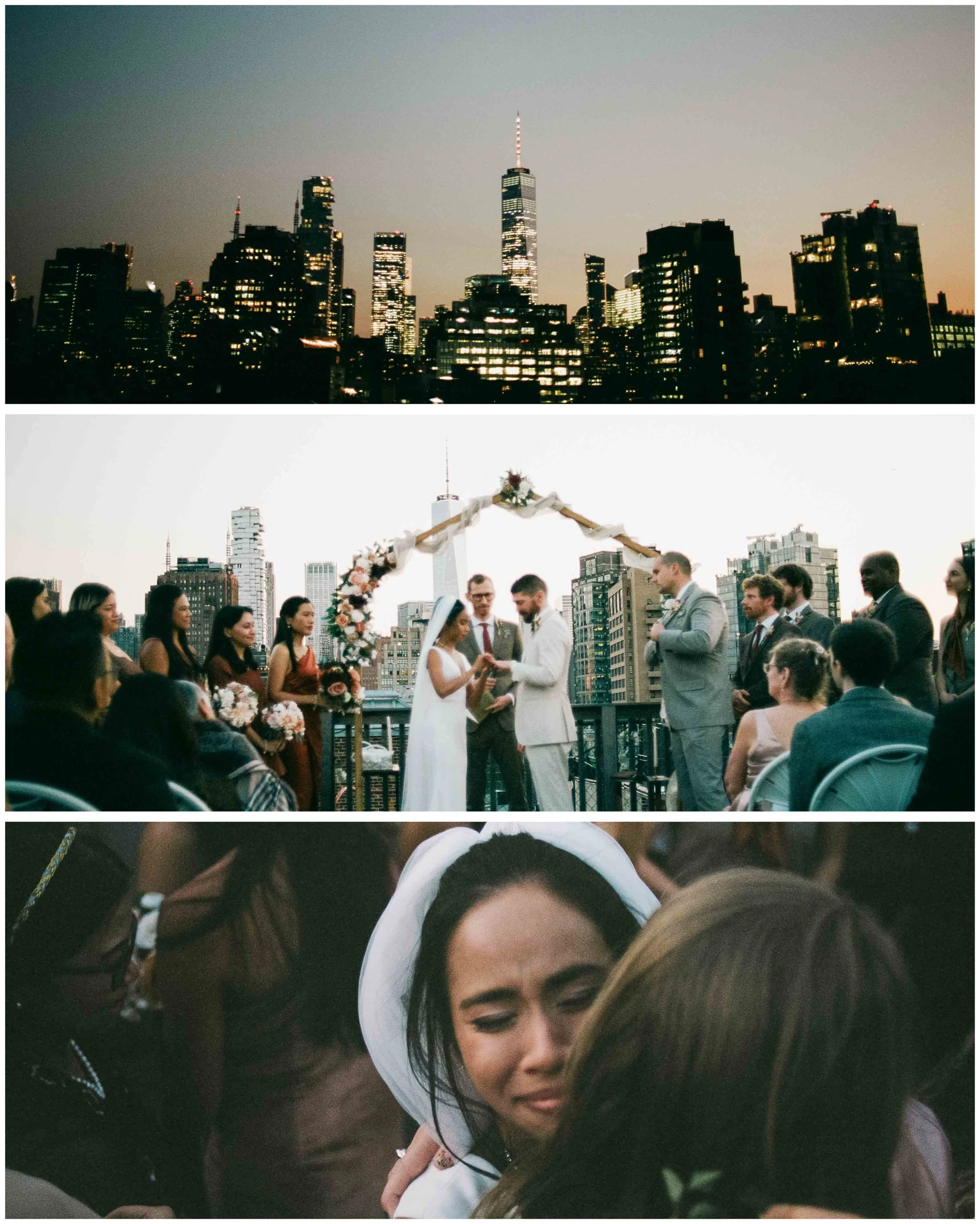 Couple exchanges rings during an outdoor ceremony, framed by the Manhattan skyline and floral arch, captured with cinematic depth inspired by The Rainbow Room.
