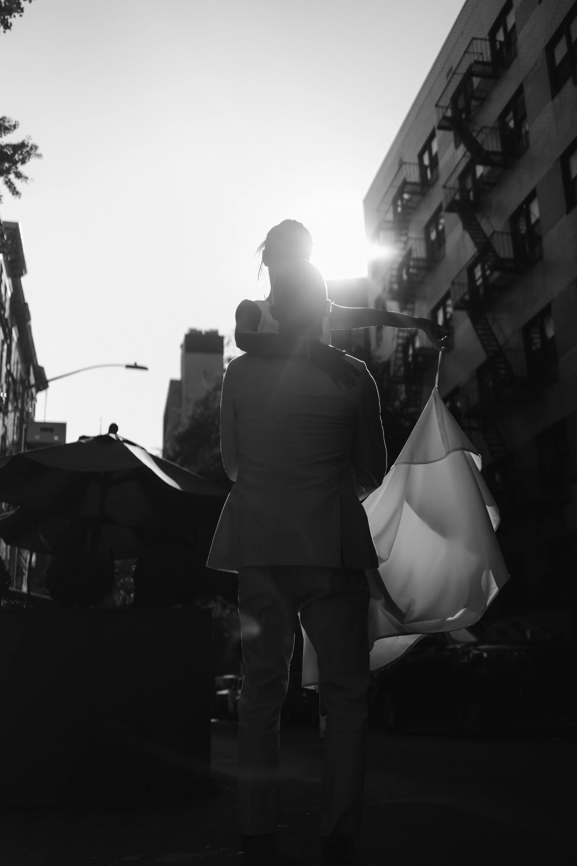 Dubai Wedding Photographer — cinematic black-and-white portrait of the groom with umbrella.