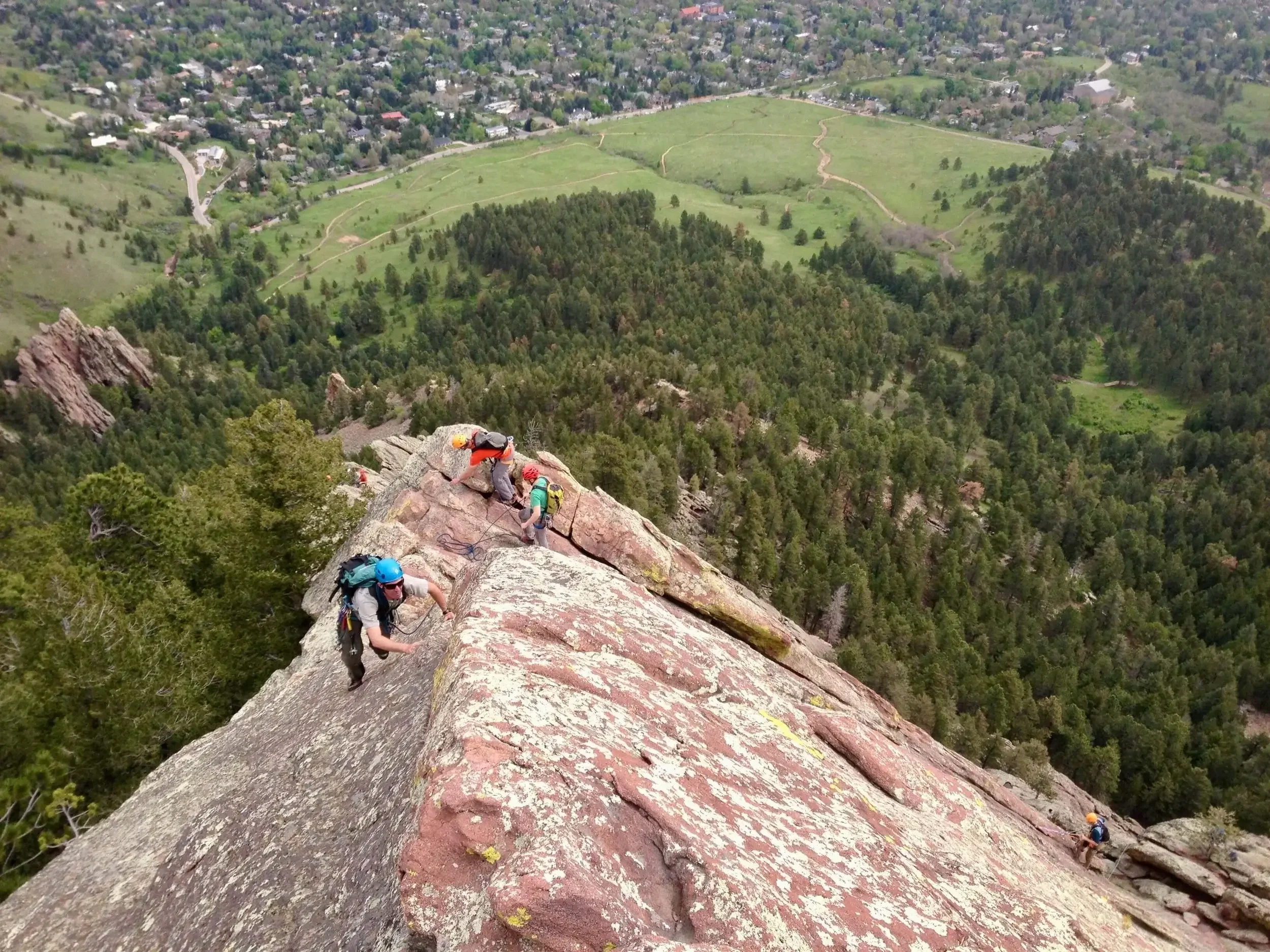 A climber leads up the North Arete on the First Flatiron.