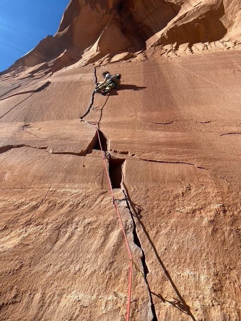 Leading the classic Keyhole Crack (5.10-) in Escalante Canyon.
