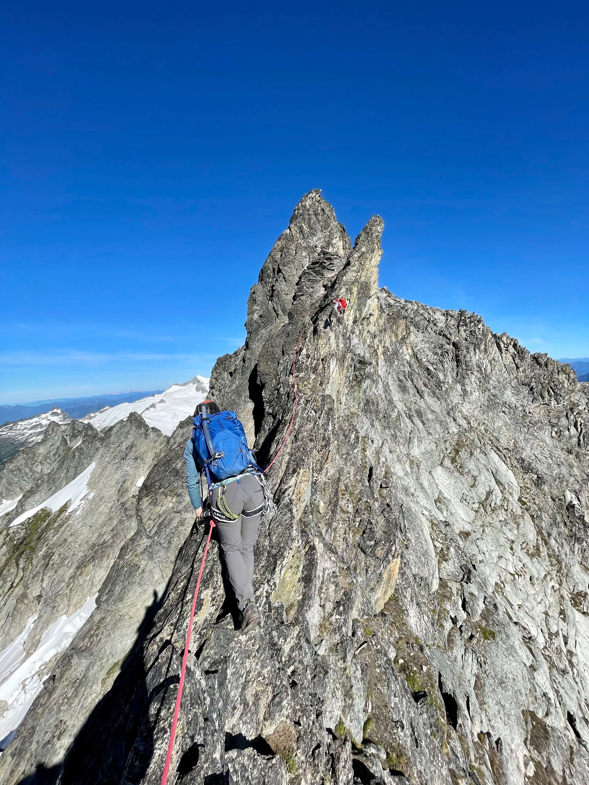 Traversing the knife edge on the East Ridge of Forbidden Peak.