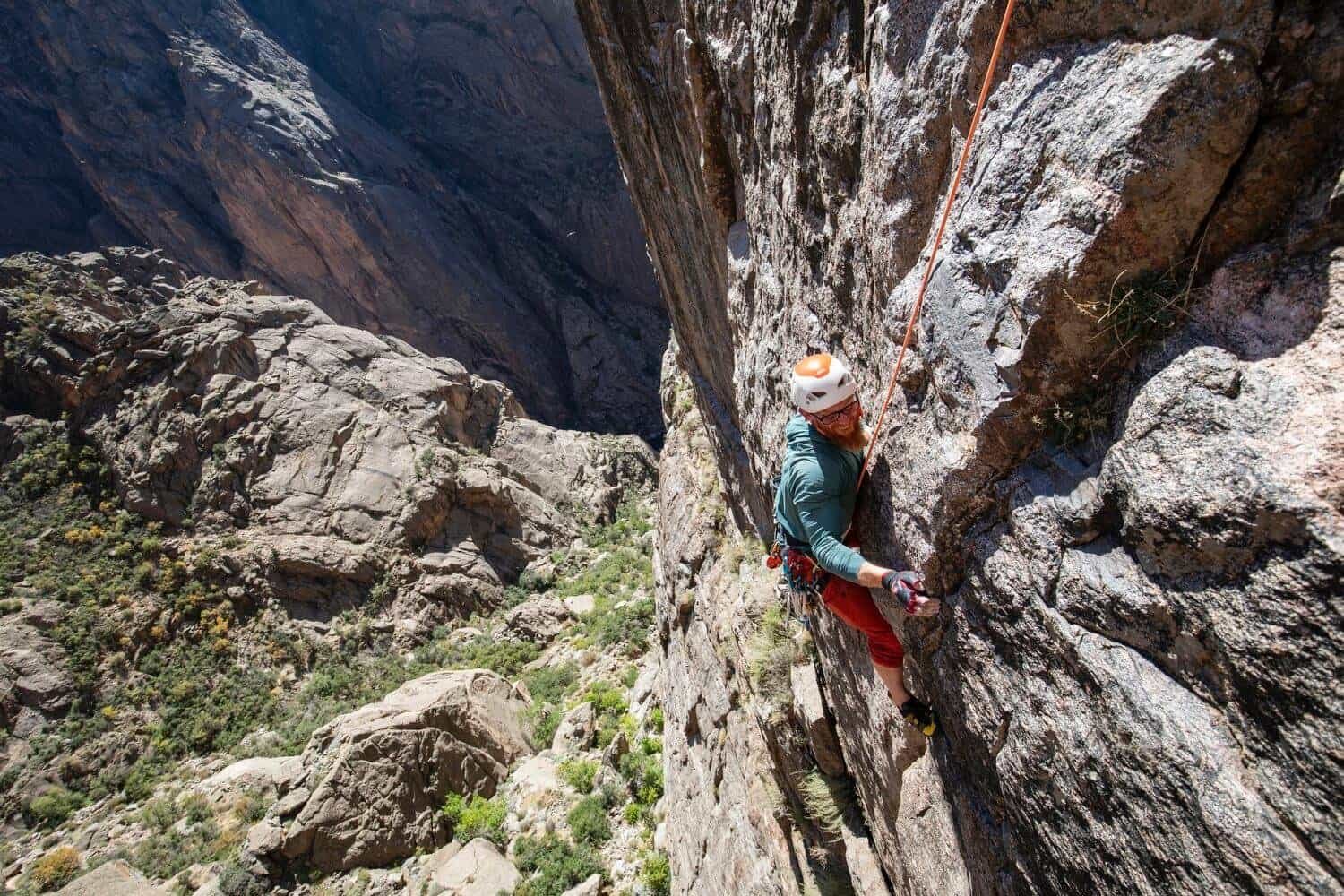 A climber is following the crux of Midsummer Night's Dream.