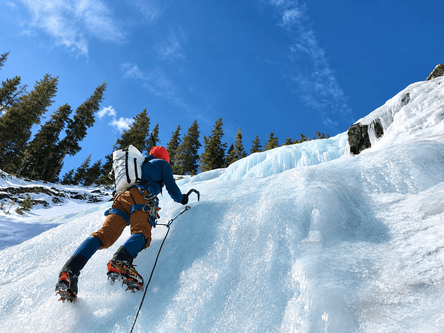 An ice climber leads a moderate ice climbing route in Silverton, Colorado during a course. 