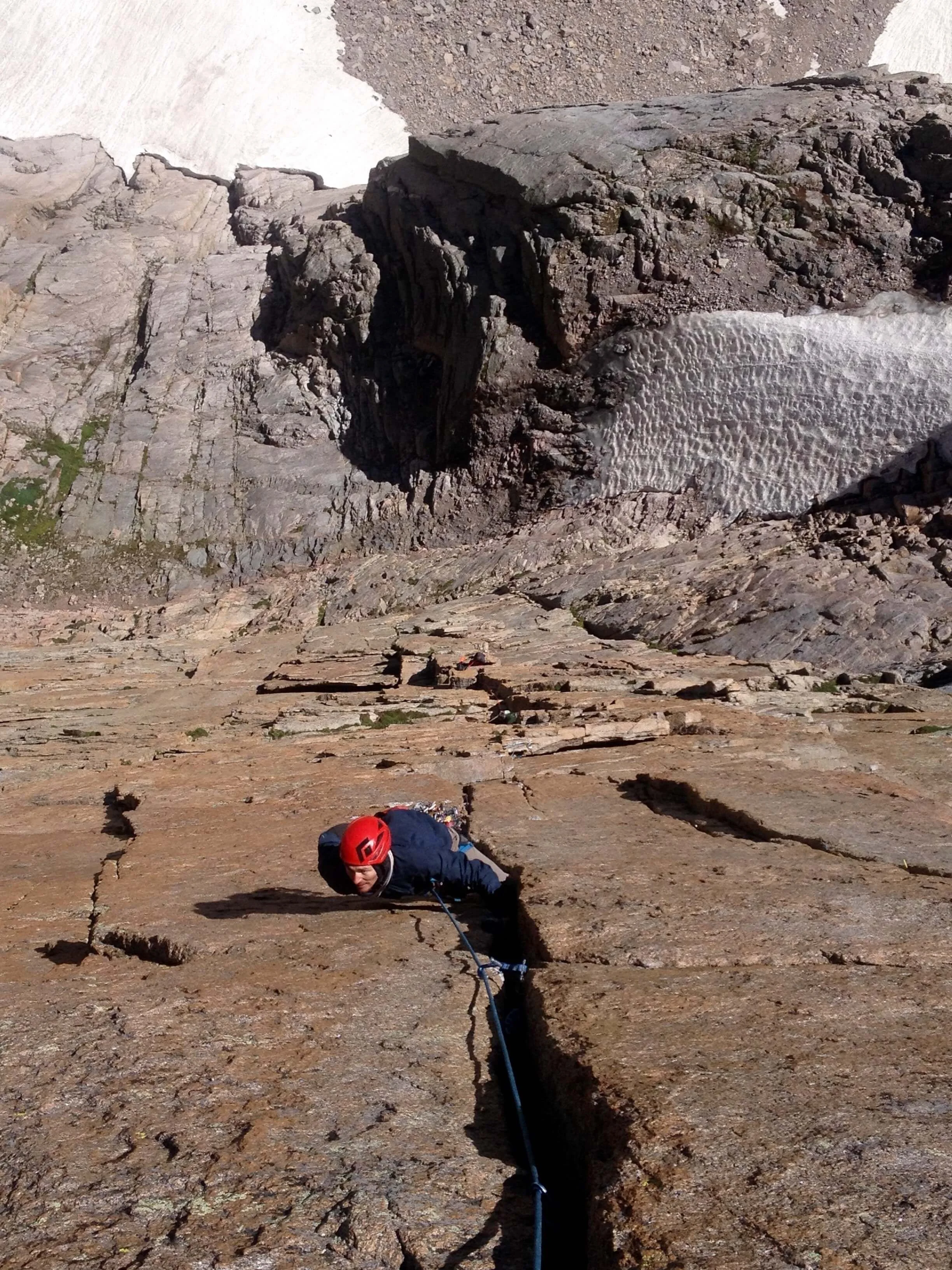 Climbing the Pervertical Sanctuary's crux pitch on the Diamond.