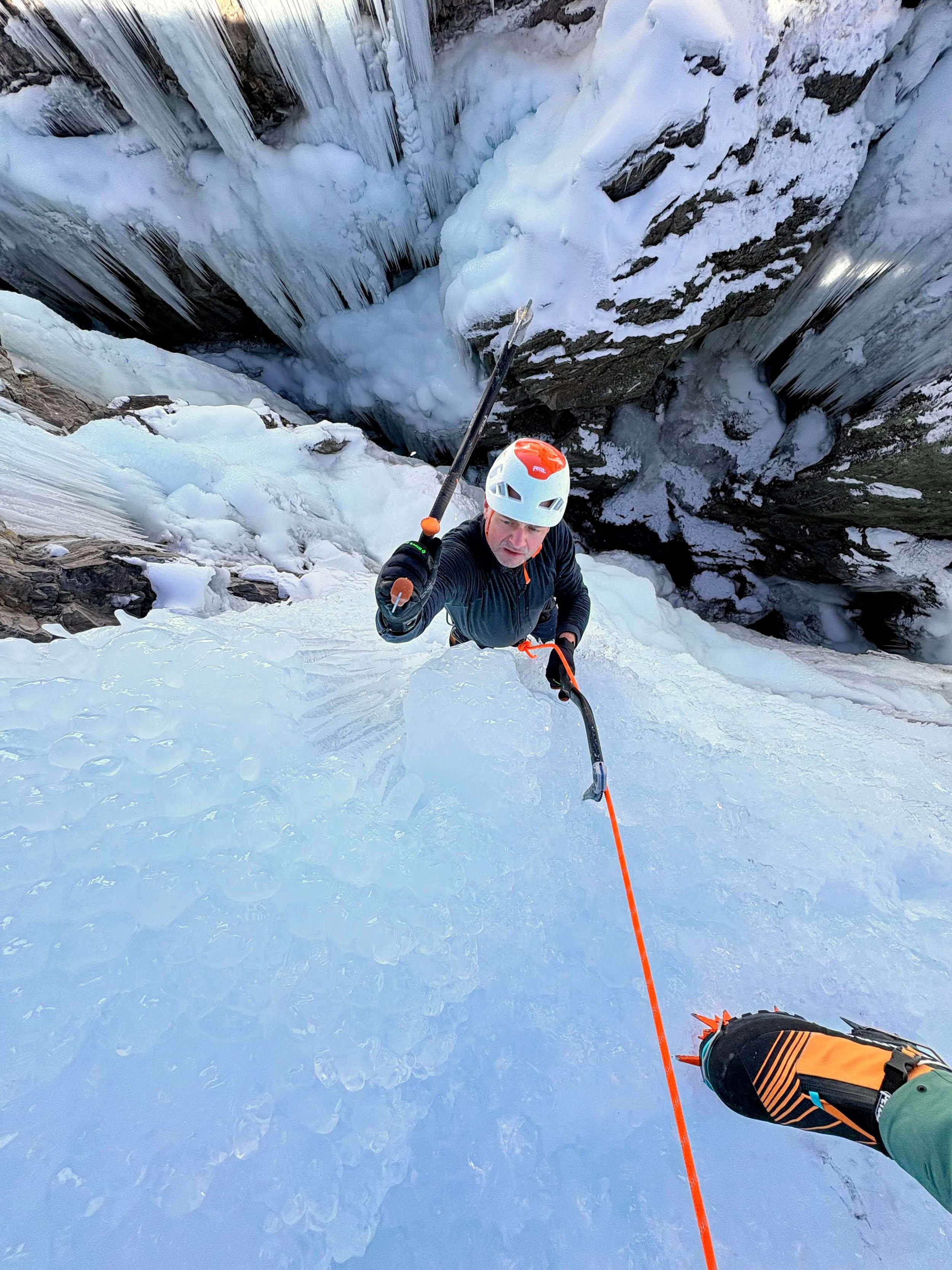 A climber swings an ice tool on a steep route in the Ouray Ice Park.