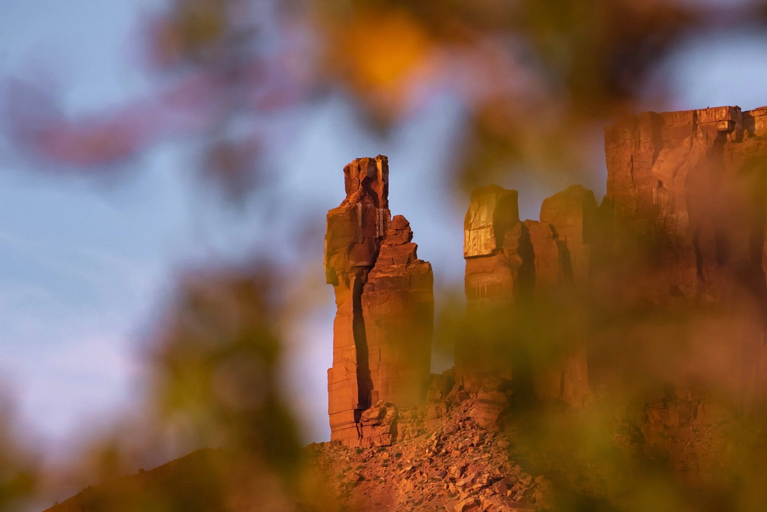 Desert towers in Castle Valley rise above the mesa awash with sunrise alpenglow.