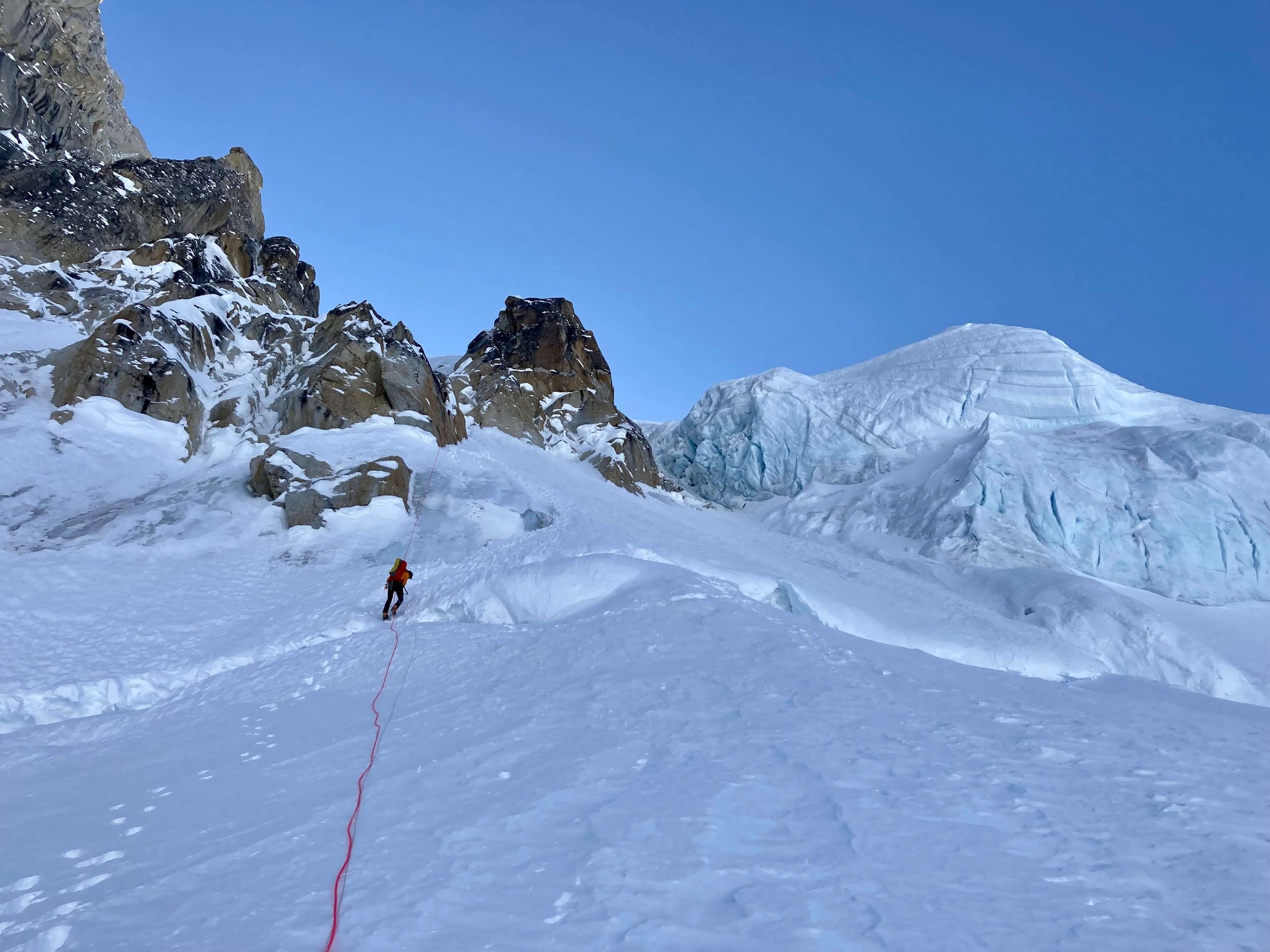 Rappelling over a bergschrund descending from the Harvard route.