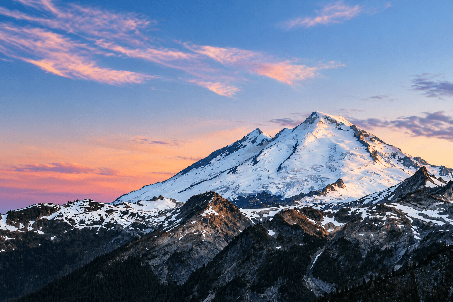 Purple alpenglow lights up the Coleman Glacier on Mount Baker.