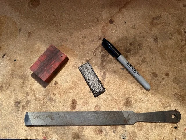 A layout of the tools needed to sharpen your ice climbing picks.