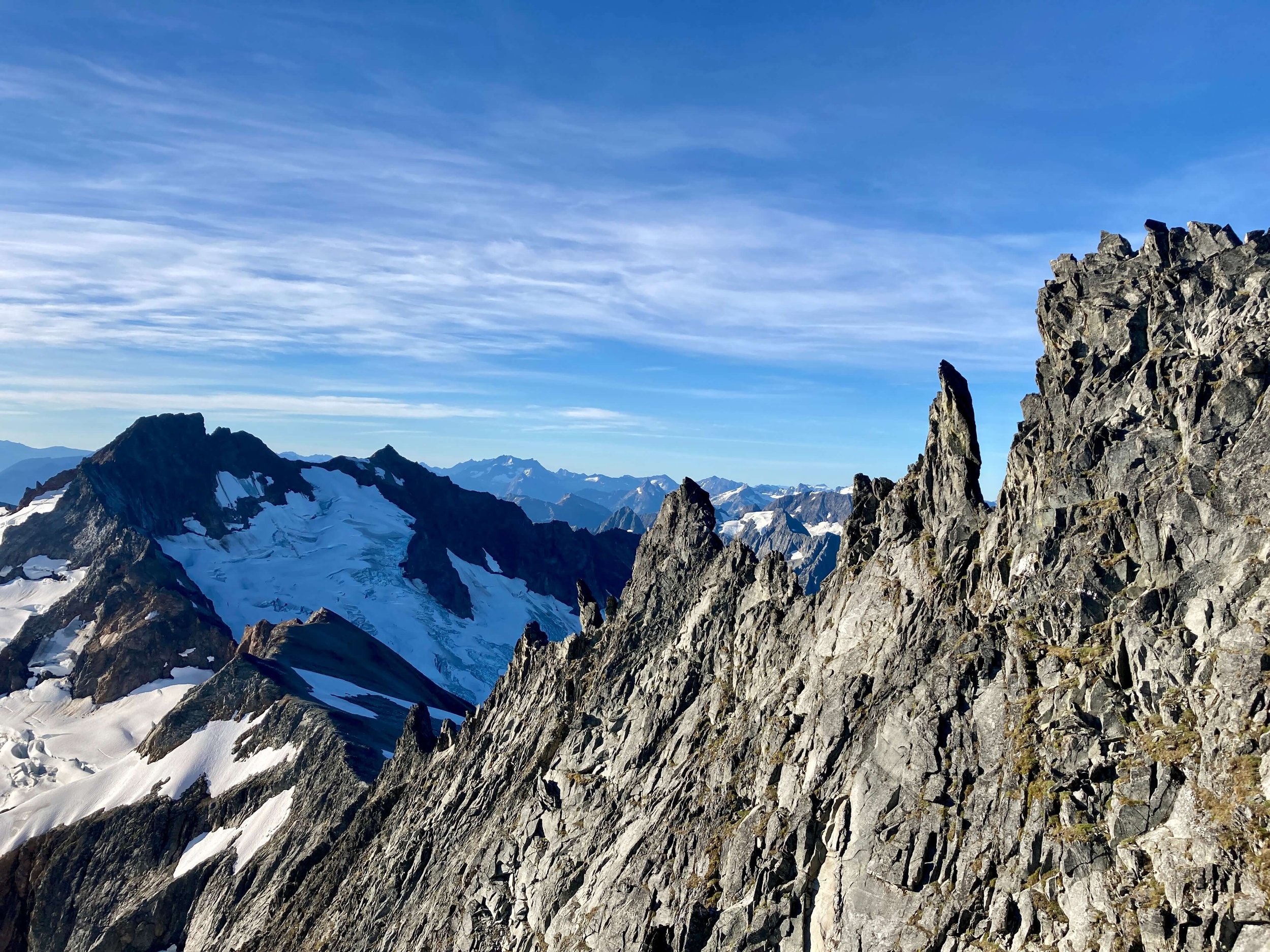 A view of the East Ridge of Forbidden Peak with Sahale in the background.