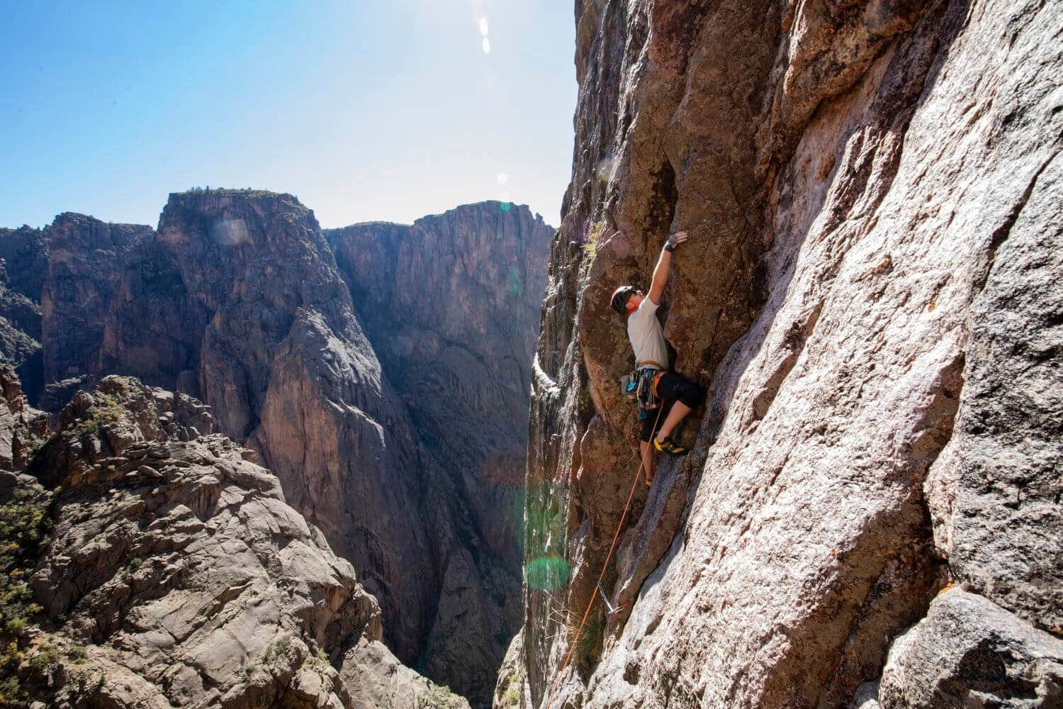 Hiding from the sun while leading in the Black Canyon.