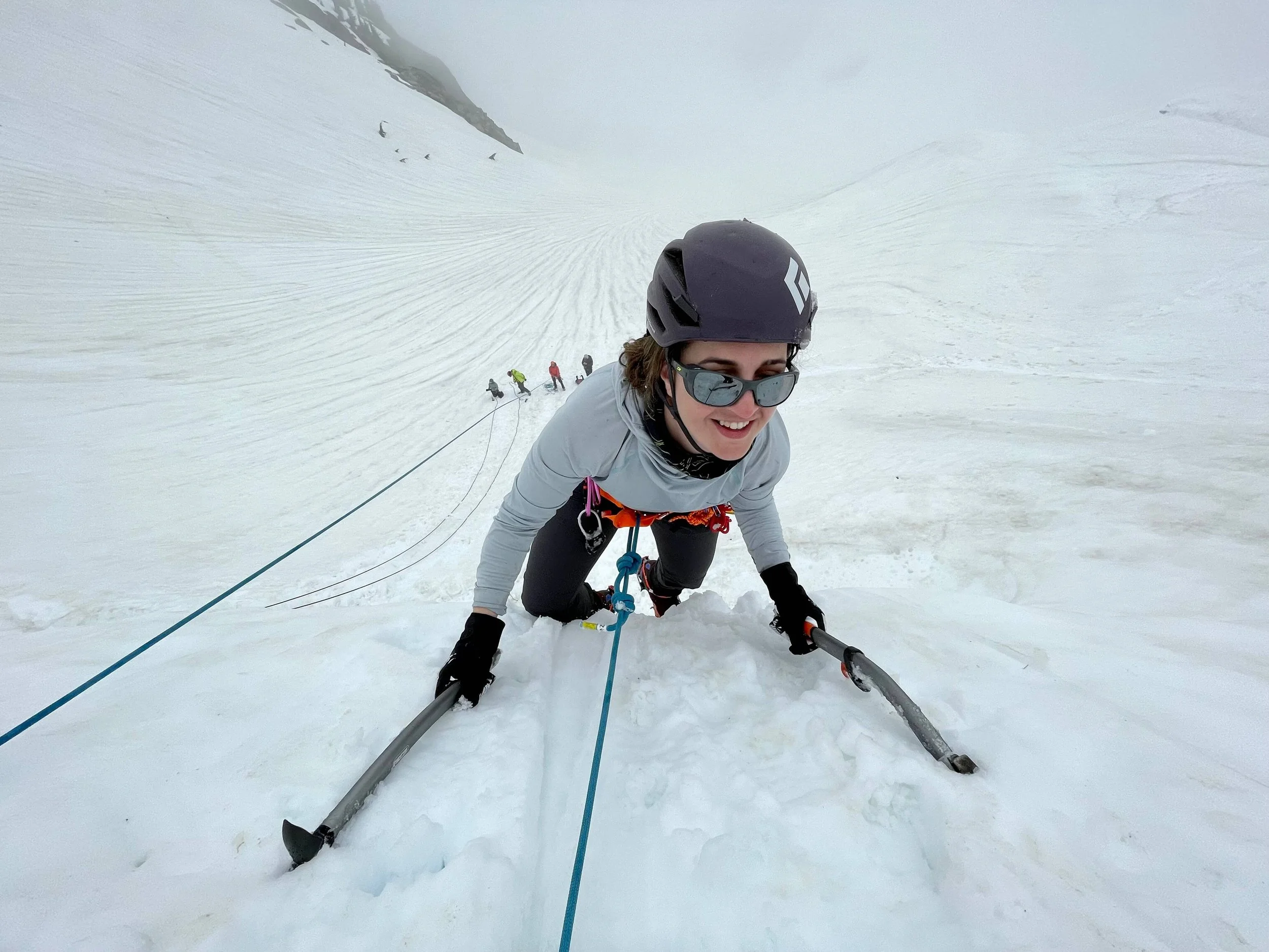 A climber practices steep snow climbing during an Introduction To Mountaineering Course on Mount Baker.