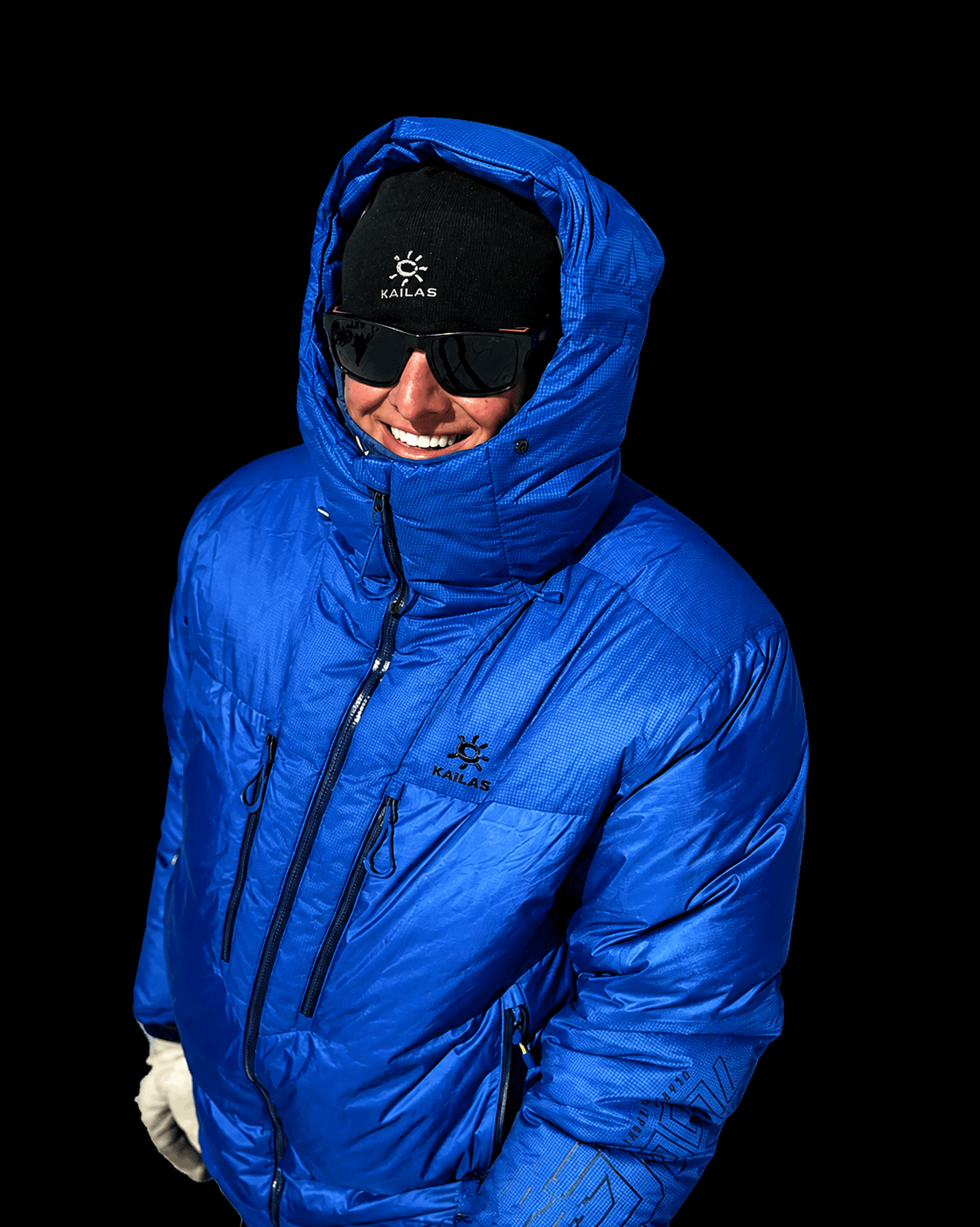 Skyward Mountaineering guide, Steven Van Sickle. He is wearing a blue puffy jacket with a black warm hat.
