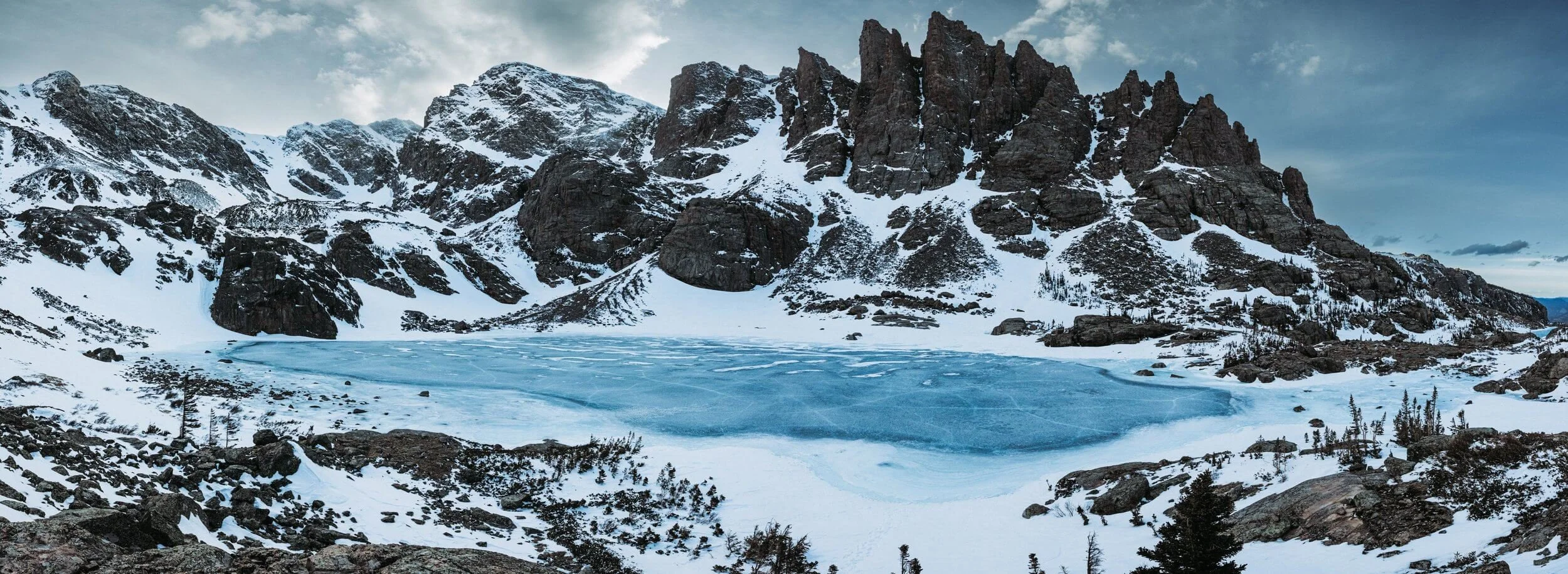Winter panorama of Sky Pond and the Cathedral Spires.