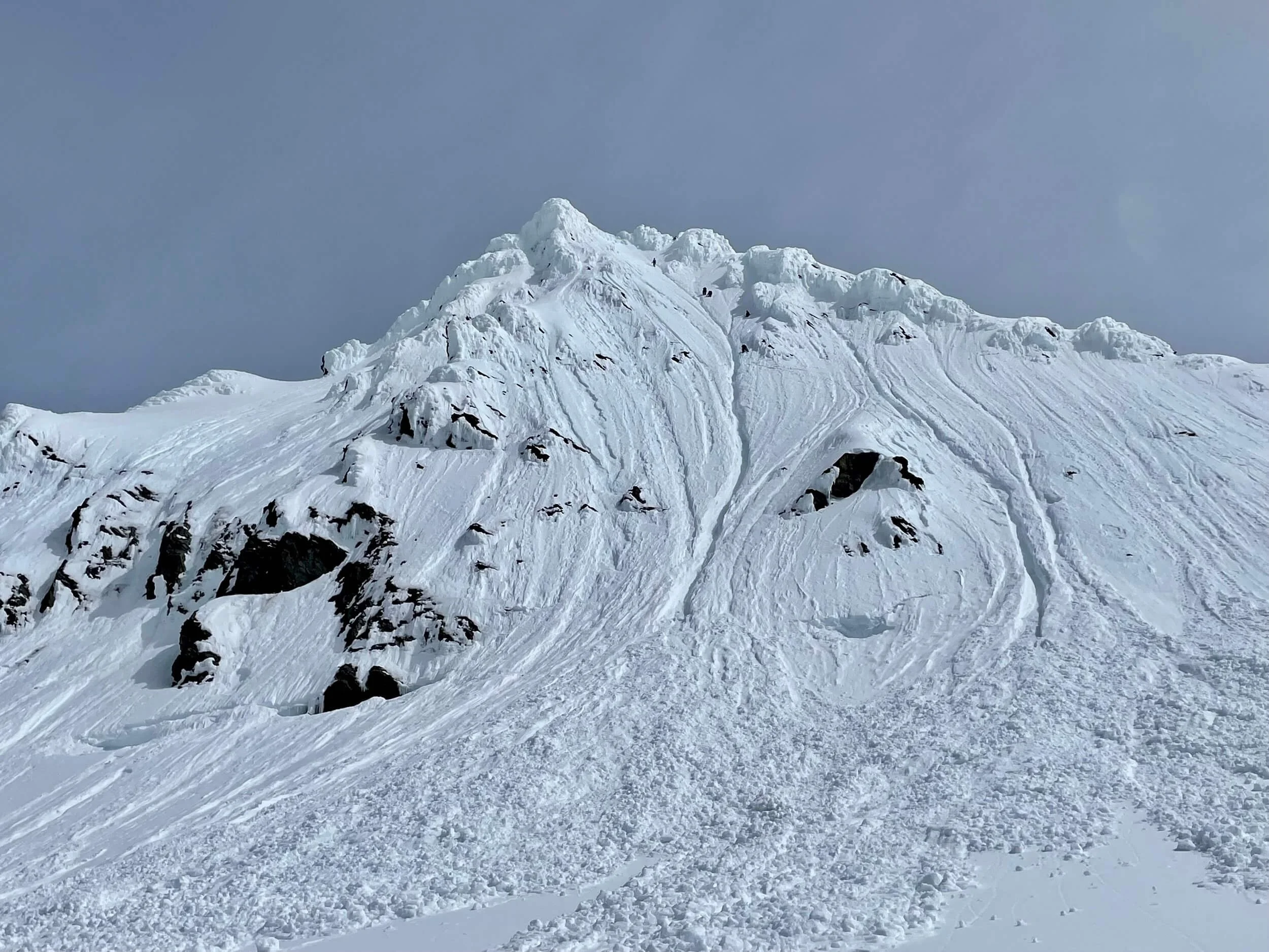 A snowy summit pyramid on Mt. Shuksan with rime ice mushrooms along the South Ridge.