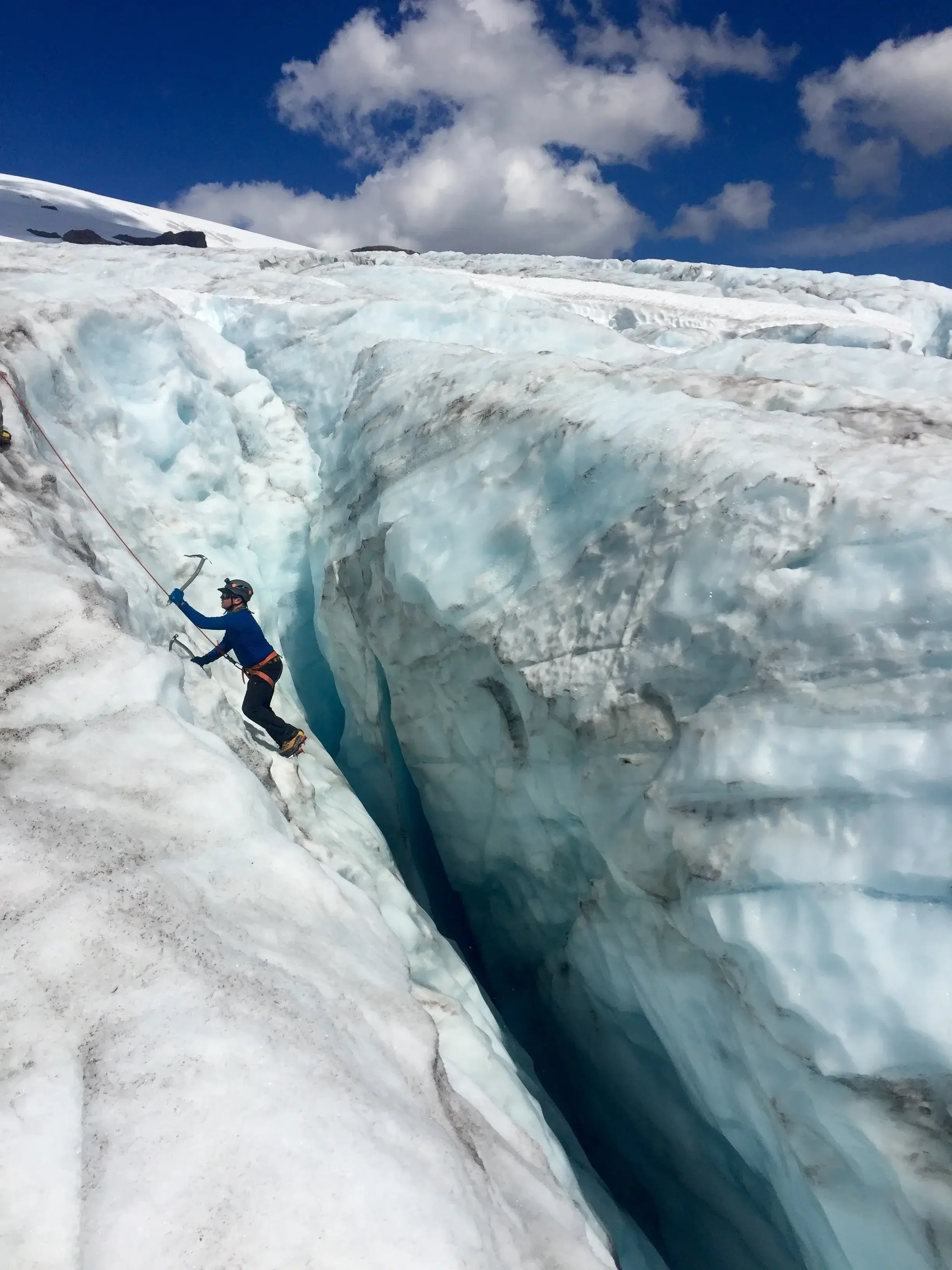 Ice climbing in a crevasse during a snow school day.
