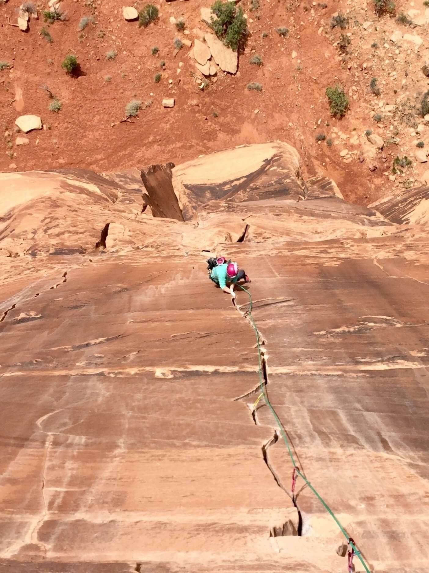 Climbing the steep splitter thin hands crack of Medicine Man (5.12-) in Colorado National Monument.