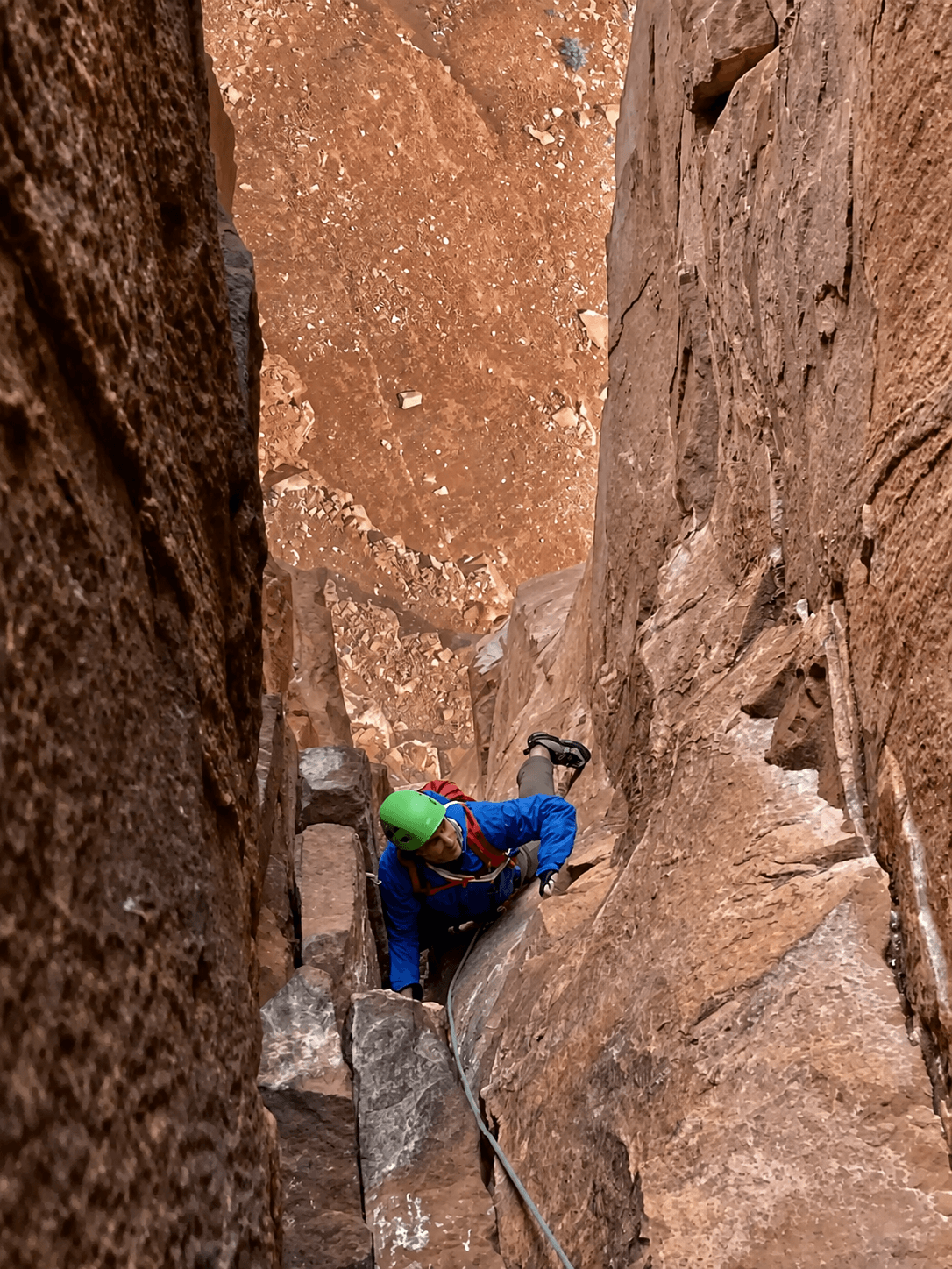 Climbing up a chimney on pitch two of Castleton Tower, near Moab, Utah.