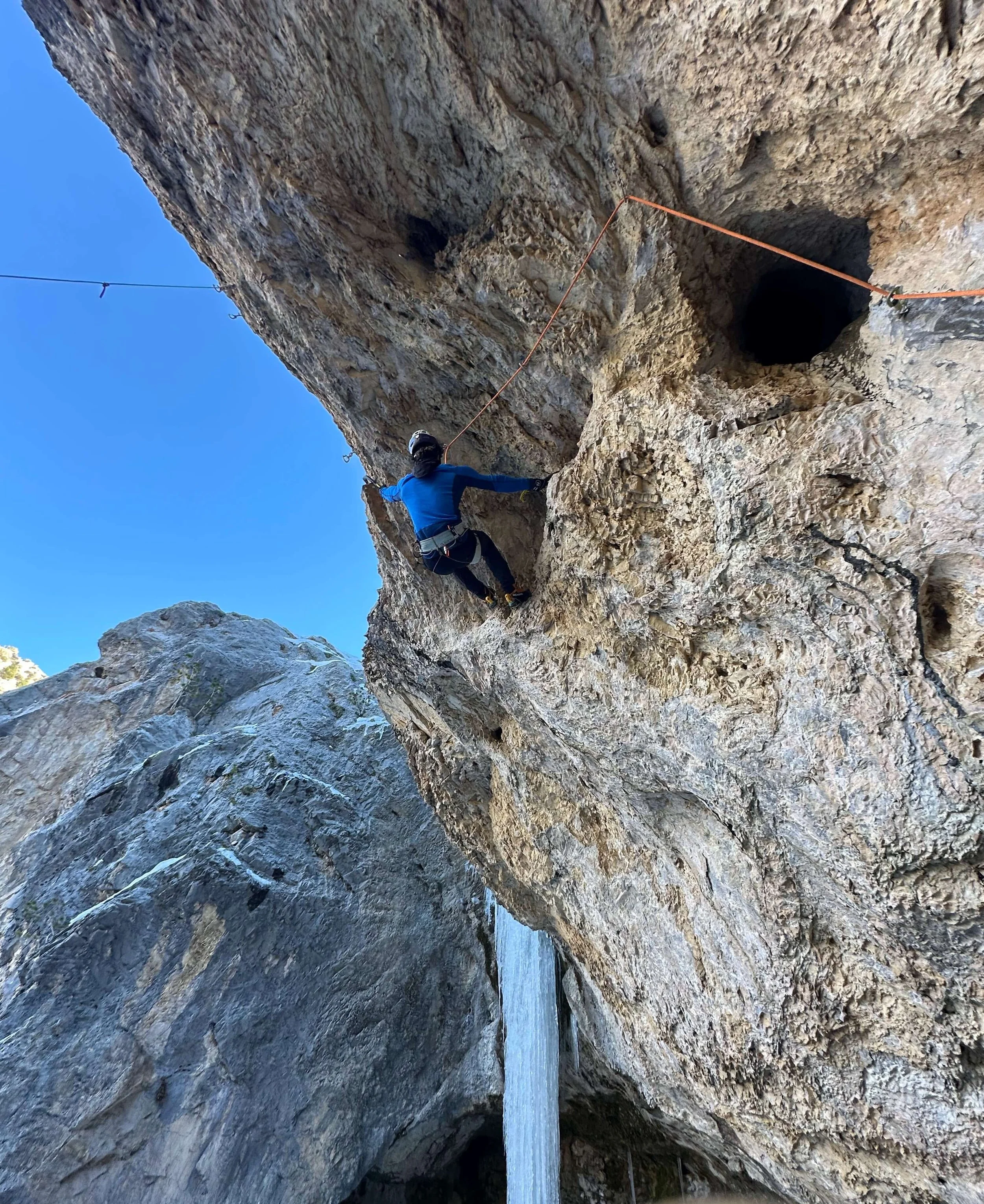Nik Mirhashemi is climbing a steep mixed climbing route at Mount Charleston.